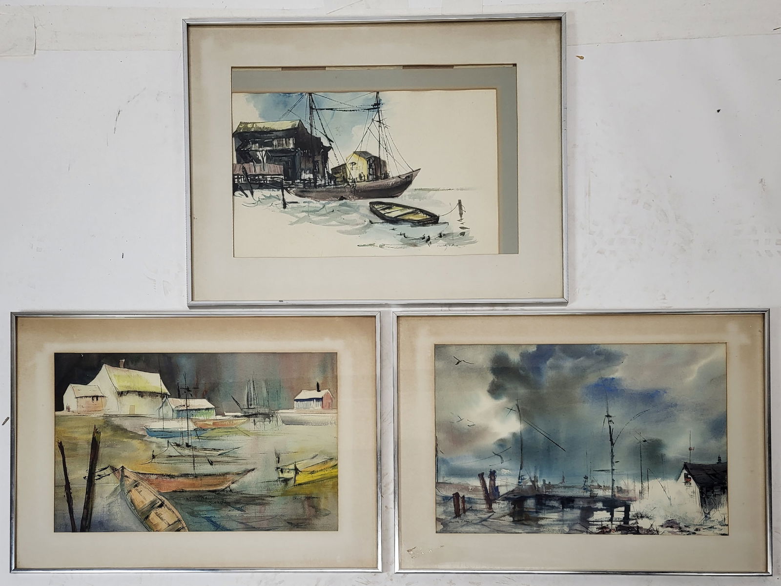 Charlotte HOFFMAN: Three Framed Watercolors: Charlotte Hoffman (American, 20th C.) a group of three watercolors each depicting different coastal port scenes with ships and buildings. Two signed lower right and one signed lower left. All framed a
