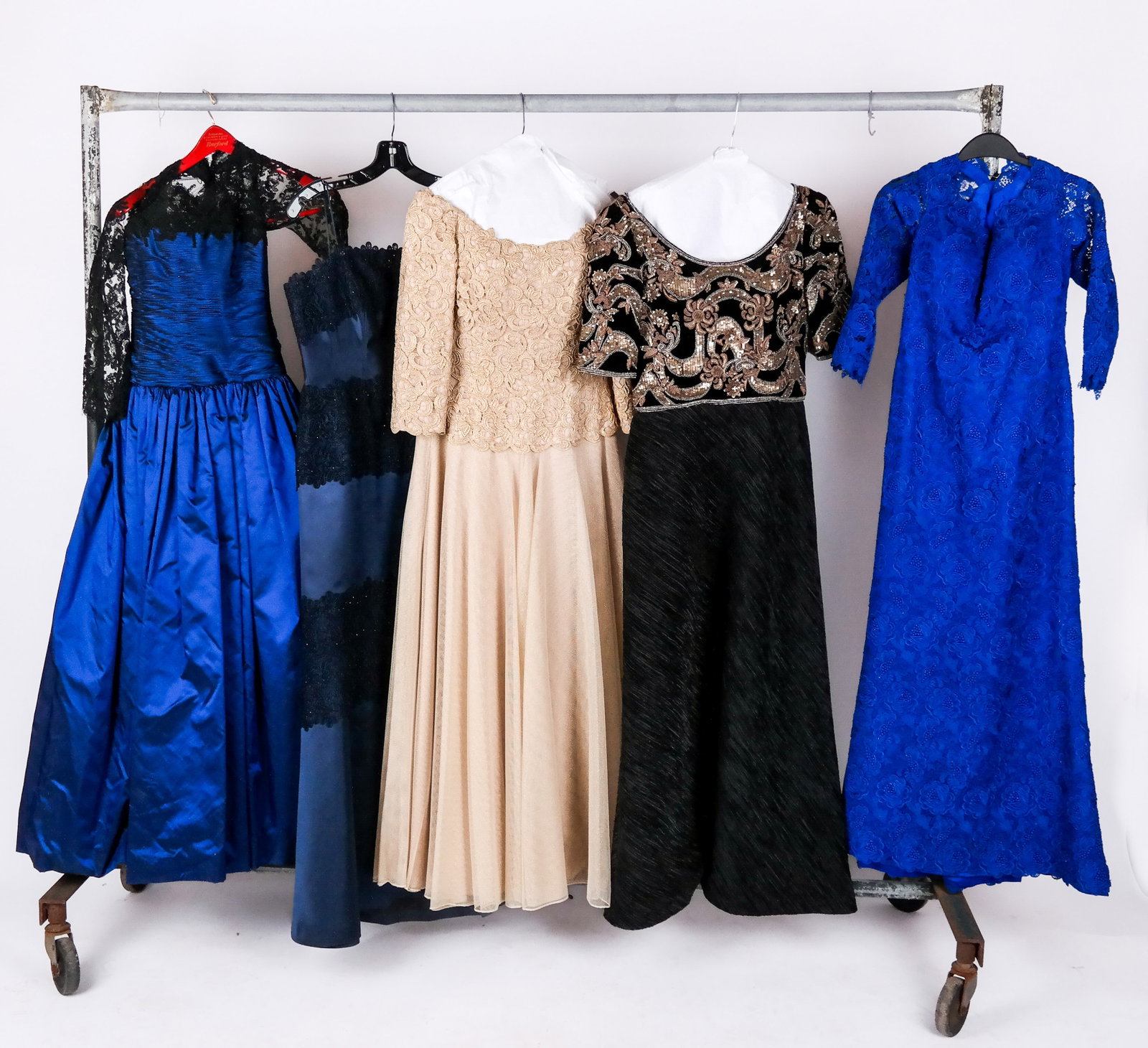 Embellished Evening Gowns, 5: Five embellished evening gowns including a Chris Kole cobalt blue silk and black lace gown with crinoline skirt, a Helen Morley silk blend dark blue and black lace mermaid gown with lace detail, a Hel