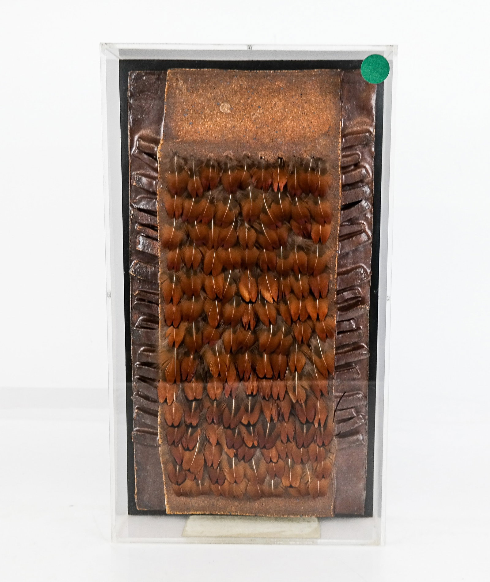 Ken SHORES: "Fetishism" - Mixed Media: Ken Shores (American, 1928-2014) mixed media work titled "Fetishism #F25", in ceramic and feathers, in a plexiglas shadowbox frame, inscribed "Gump's Gallery, San Francisco" on back. [13.5" H x 7.75" 