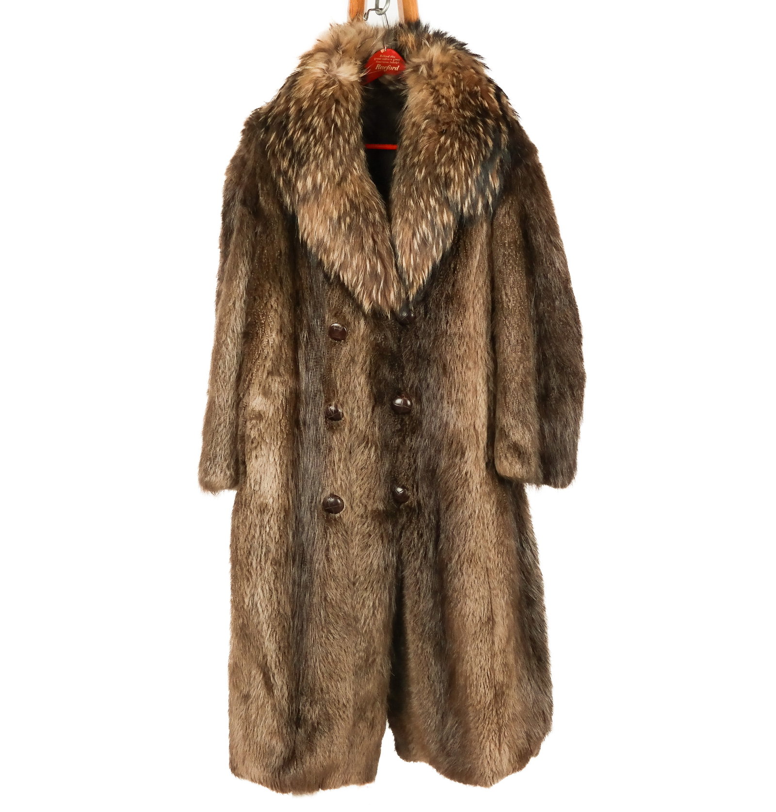 Beaver Fur and Raccoon Coat: Beaver fur and raccoon trimmed double breasted coat with leather buttons and loop closure and invisible pockets to outside and breast pocket. [Neck to hem: 50"; shoulder to shoulder: 25"; shoulder to 