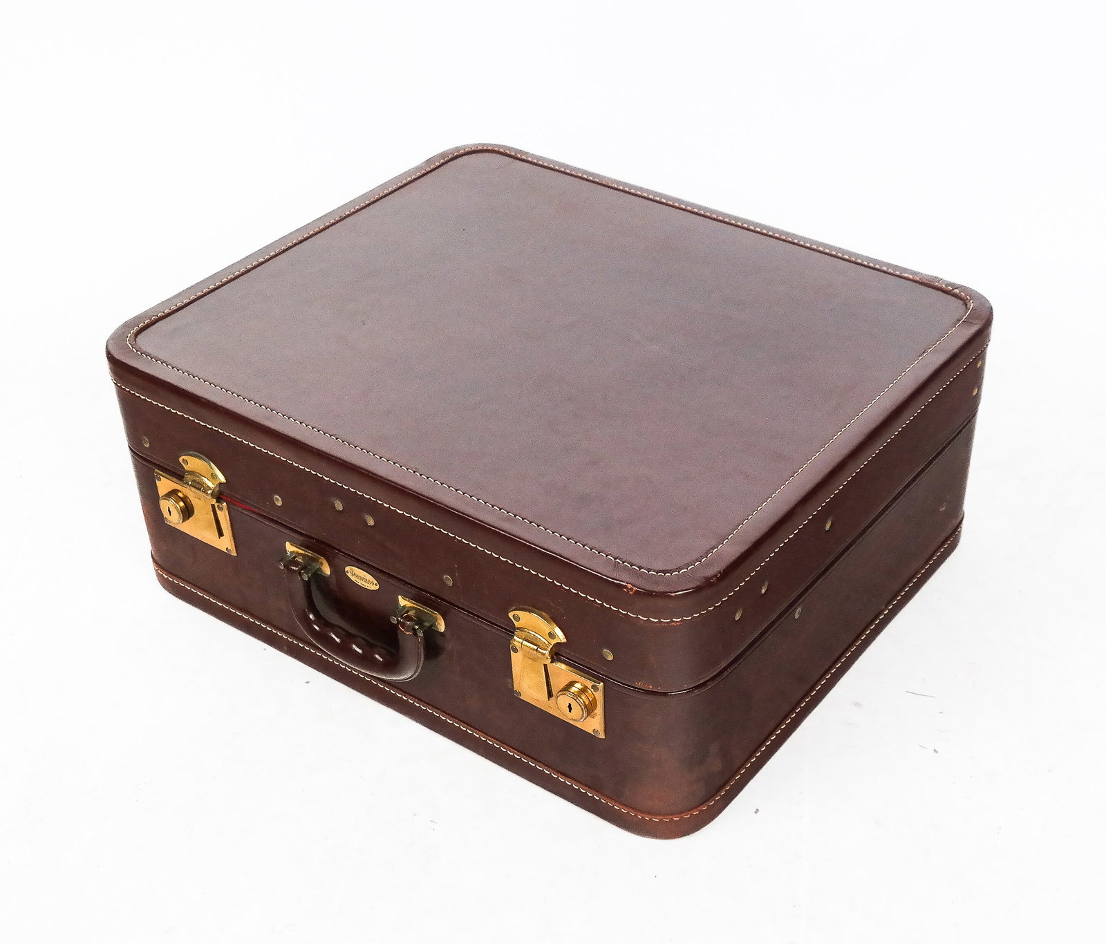 Maximilian Leather Suitcase: Maximilian leather suitcase with outer cover and red lining with compartments including four removable hangers. [18" H x 21" W x 9.5" D]. Overall good condition with some spotted scuffing to leather.
