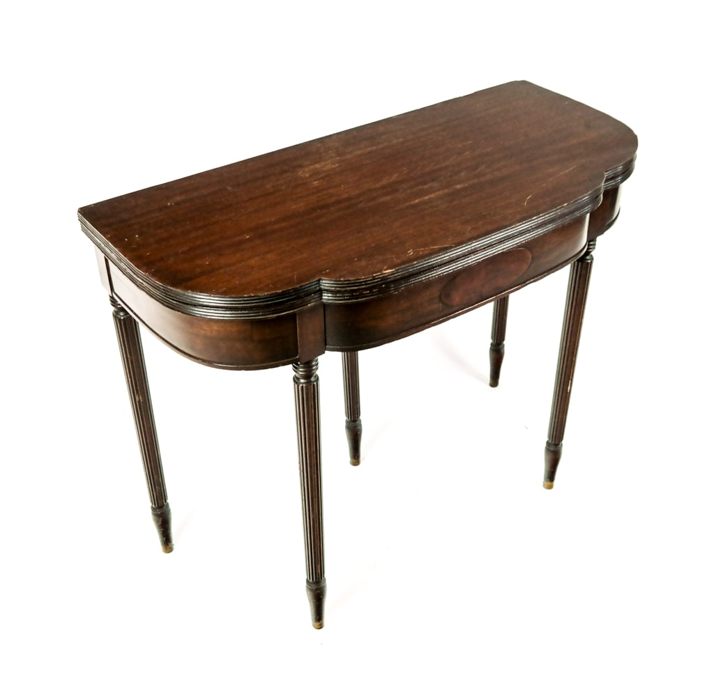 Sheraton-Style Lift-Top Console: Sheraton-style mahogany lift-top console with back swing leg. [29" H x 36" W x 17" D (closed)]. Scratches. Condition reports and requests for additional photos cannot be accepted on this lot; please b