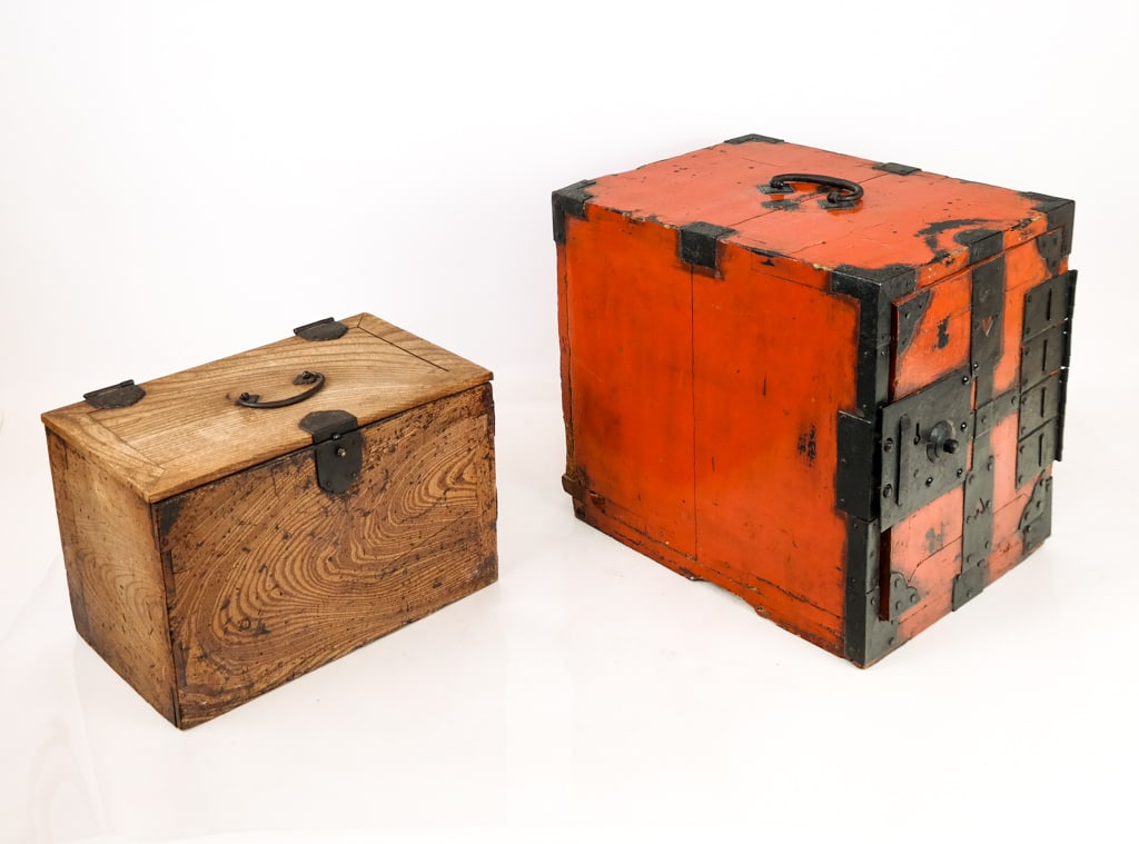 Two Japanese Wooden Travel Chests, 19th C: Rectangular wooden travel or sea chests with drawers and hinged doors, one natural wood and other red lacquered wood finish. [Largest: 13" H x 15" W x 11" D]. Both with various losses to hardware and