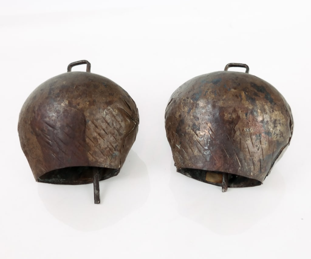 Mounted Bronze Ceremonial Bells, 20th Century: A pair of wall-mount design hammered bronze patina ceremonial bells. Fitted with matching metal mounting armature hardware. Both functional. From Wexler residence bedroom north wall. [6.5" H x 5.75" W