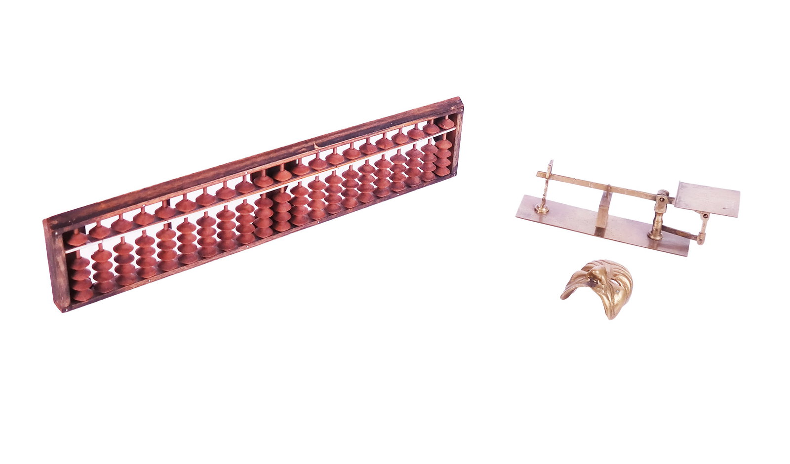 Mordan & Others Collection of Curiosities: Collection of curiosities comprising S. Mordan postal scale, London [1.5" H x 6" L x 1" D], wood abacus [2.75" H x 12.25" L x .5" D], and a brass mask [1.5" H x 1.5" W x .75" D] Overall condition is g