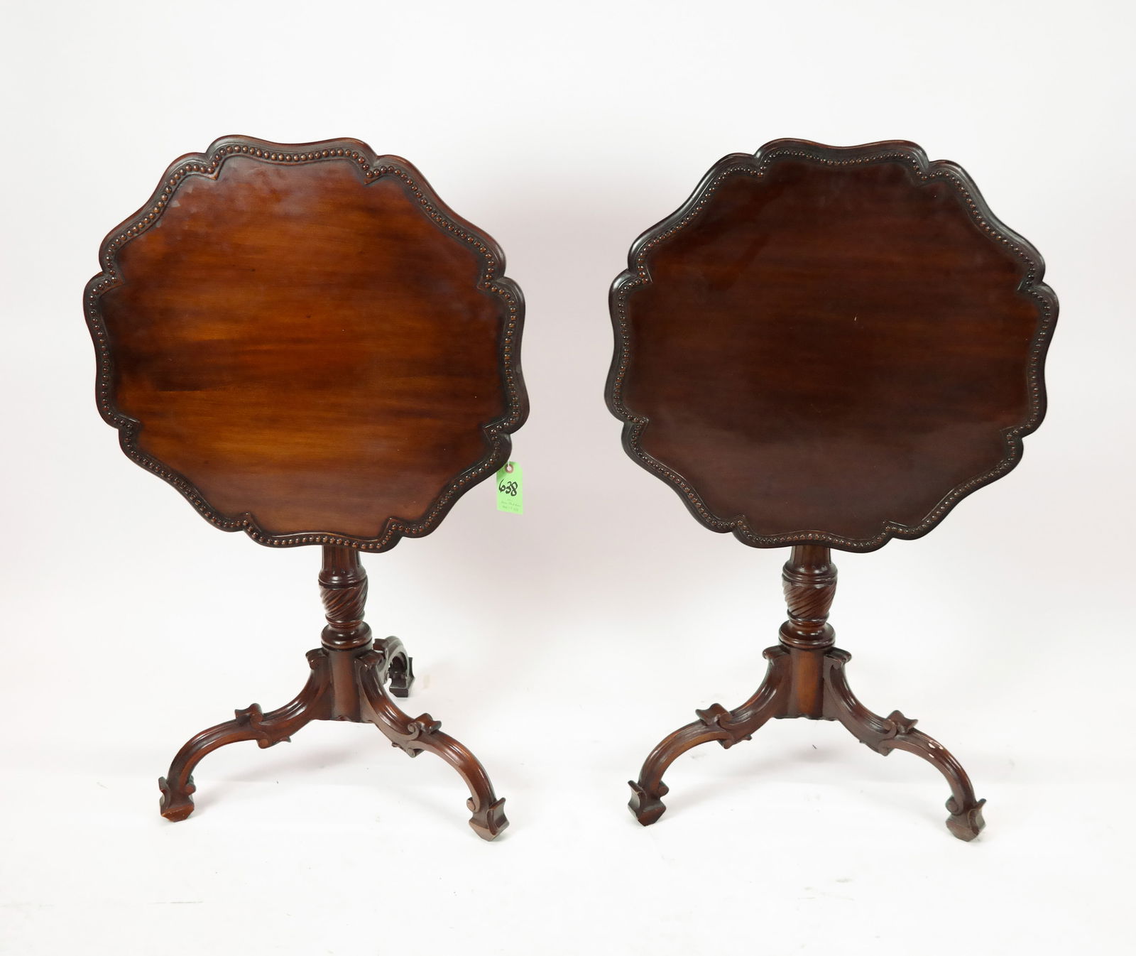 Pair of Tilt Top Tea Tables: A pair of tilt top tea tables, 20/21st century, with pie crust edges and column stems sitting on tripod bases. [29" H x 26" D] Overall Good Condition.