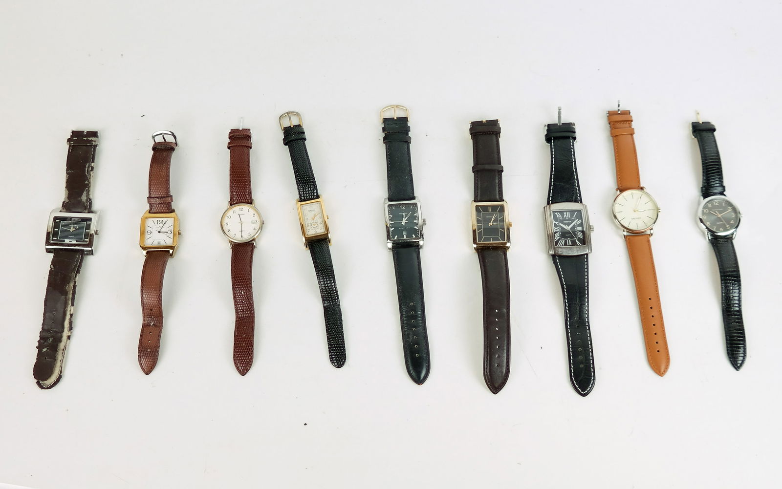 9 Men's Wristwatches: Nine men's wristwatches, including Guren Curvex, Fossil Arkitekt, Kendall & James, Bijoux Terner, and others. Lot sold "as-is". Condition reports and requests for additional photos cannot be accepted