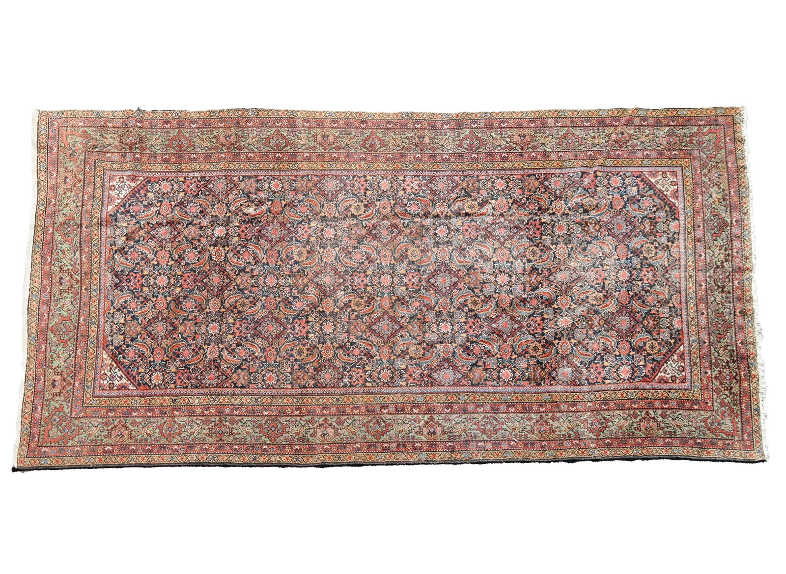 Antique Persian Rug: Antique Persian rug made from hand-knotted wool with four medallions and scrolling border. [79.5" W x 156" L]. Overall good condition with light fading and wear commensurate with age.