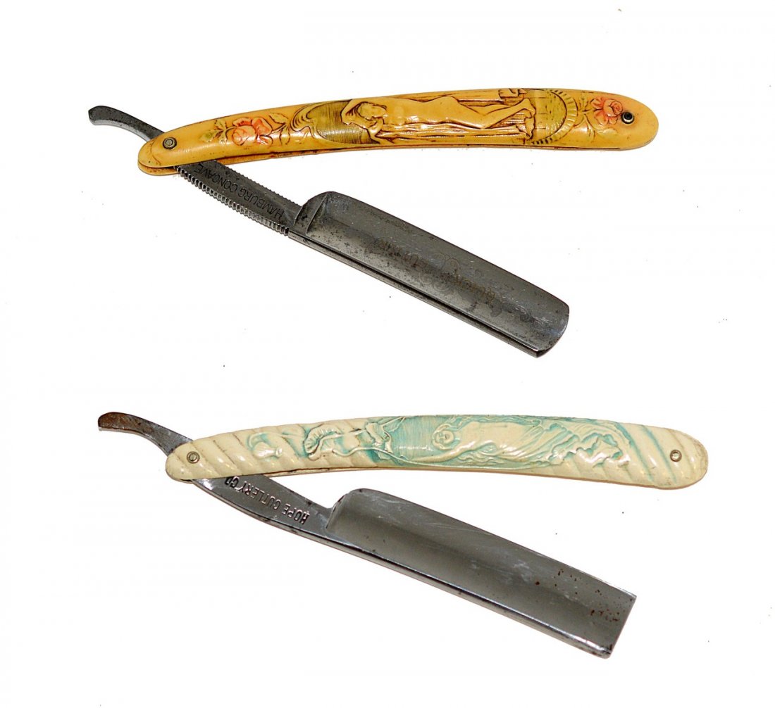 Two German Straight Razors - Nude Scales: Comprises a half-hallow razor marked on tang "J. Albert Schmidt..." Features a white scale with art nouveau style nude. Accompanied by a faux ivory (celluloid) razor with a neo-classical style female