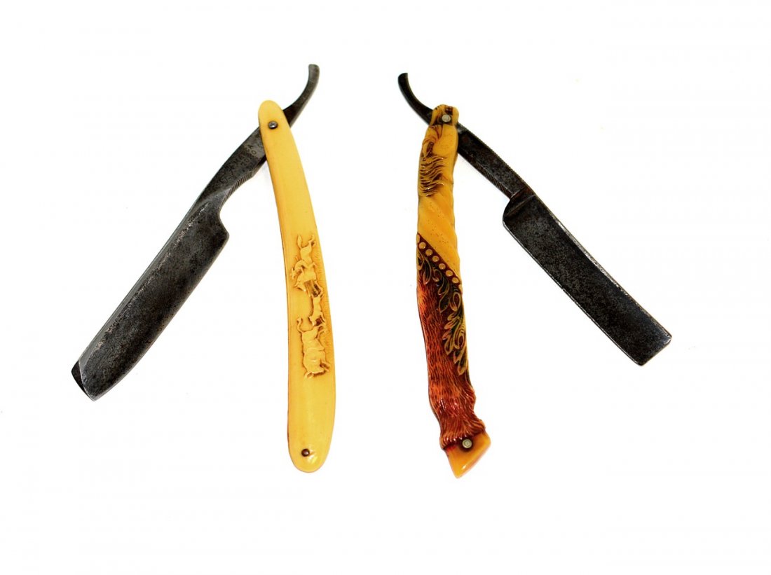 Two German Straight Razors with Western Theme: Comprises a razor with horse-form celluloid scales stamped on shank "Freije Asha / Made in Germany." Accompanied by a razor with cowboy scene scale stamped on shank "Marga Toro" and "J. B. H. & S. Sol