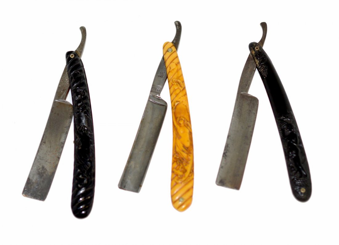 Three Straight Razors, Female Nude Scales: German straight razors with female nude molded scales. 1.) Blade stamped on shank: "J.Albert Schmidt Nachf.." Bears scale with nude picking grapes. 2.) Blade stamped on shank "Lafayette Cutlery Co..."
