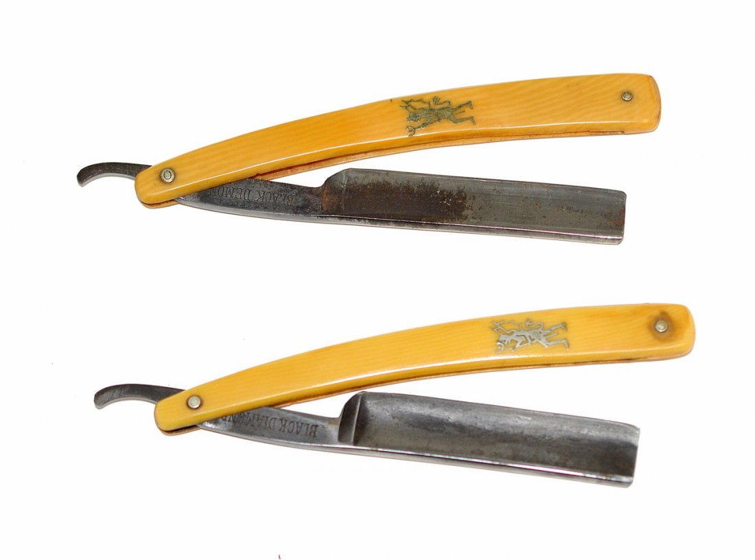 Two Straight Razors with "Demon Scales": Each bear a silver deposit demon on scale with pitch fork, tail, and bat wings. 1.) "T.Noonan & Son / Boston Mass./ ...Germany" and "Black Demon"on shank. 2.) "H.J. Cannon Boston, Mass / Germany" and 