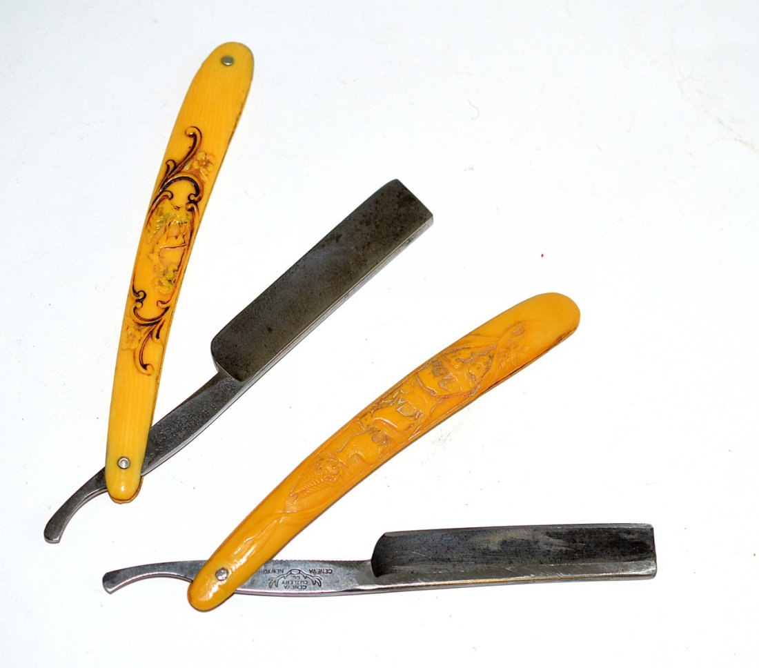 Two Straight Razors with Stag Scales: Both bear mould formed celluloid scales. 1.) Depicts stag, doe, and fawn stamped on shank "Geneva Cutlery Co. Geneva, NY." 2.) Stag among flower and pine tree. Stamped on shank "R.H. Whitney & Co. / P