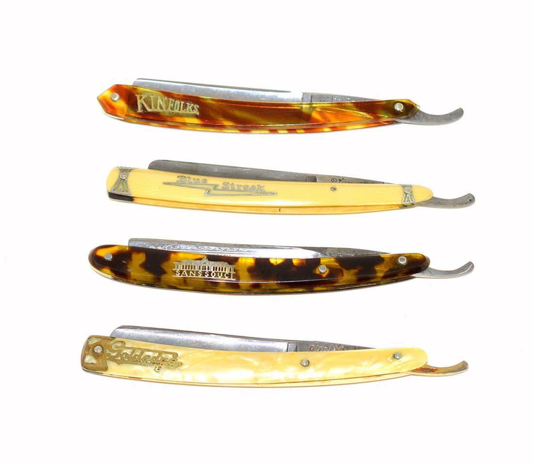 Three Straight Razors with Logo Scales & Other: Comprises three razors with faux tortoise and ivory scales and pearlized celluloid. Each feature brass or silver deposit logos including: "Sans Souci," "Gold Edge," and "Blue Streak." Shanks stamped v