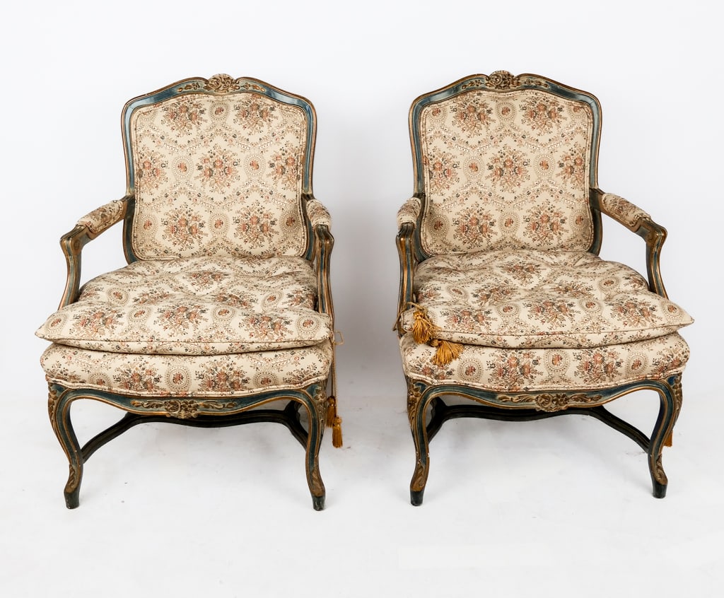 Pair Louis XVI Decorated & Upholstered Fauteuils: Pair of Louis XVI carved and decorated fauteuils , 20th century, with carved and painted foliate decoration throughout, floral printed upholstery, on cabriole legs. [37" H x 28" W x 25" D; seat height