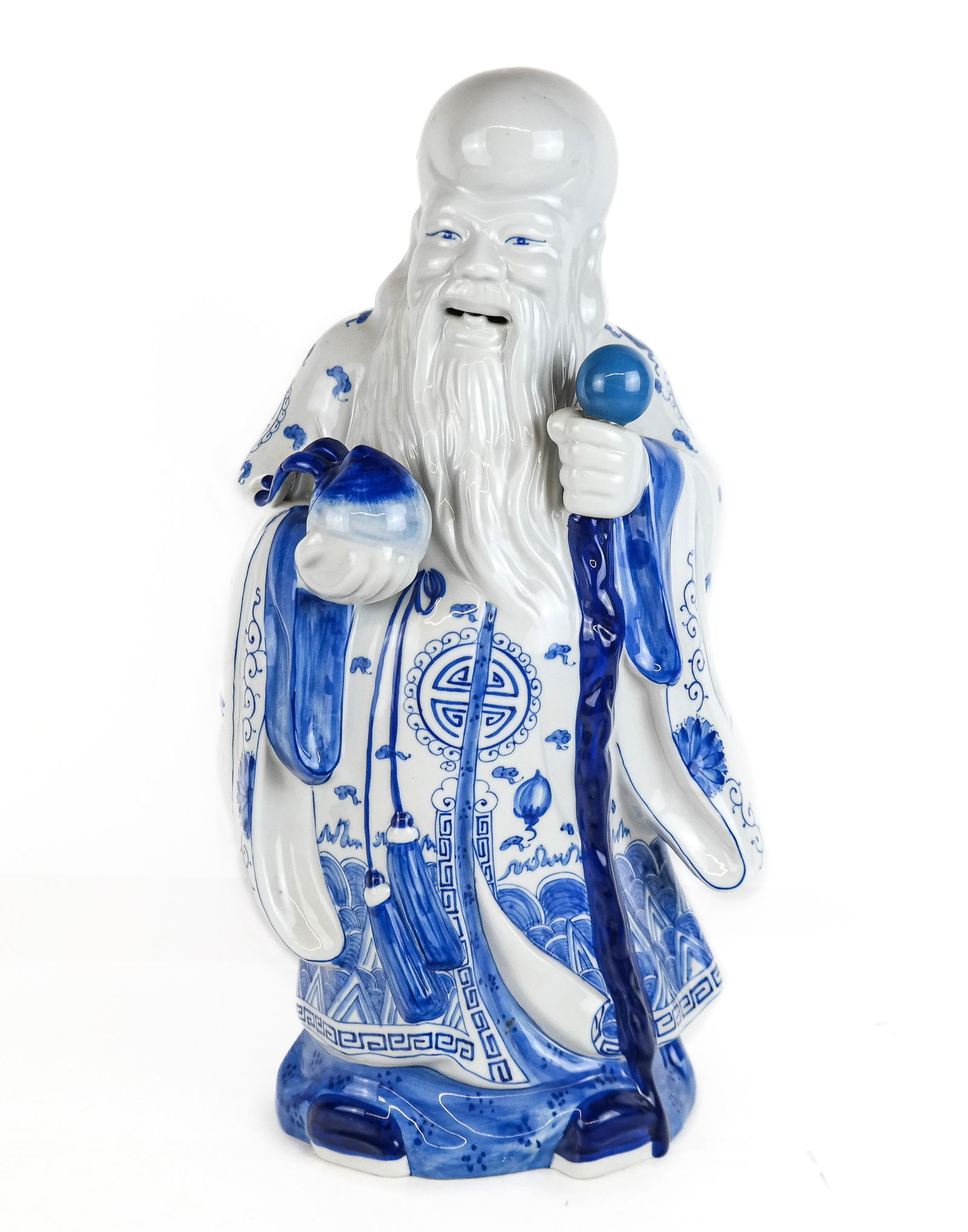 Chinese Dehua Decorated Figure of Shou Xing: Chinese dehua decorated porcelain figure of Shou Xing, the god of longevity, 20/21st century, with an apocryphal mark to base. [19" H x 10" W x 7.5" D]. Overall condition is good.