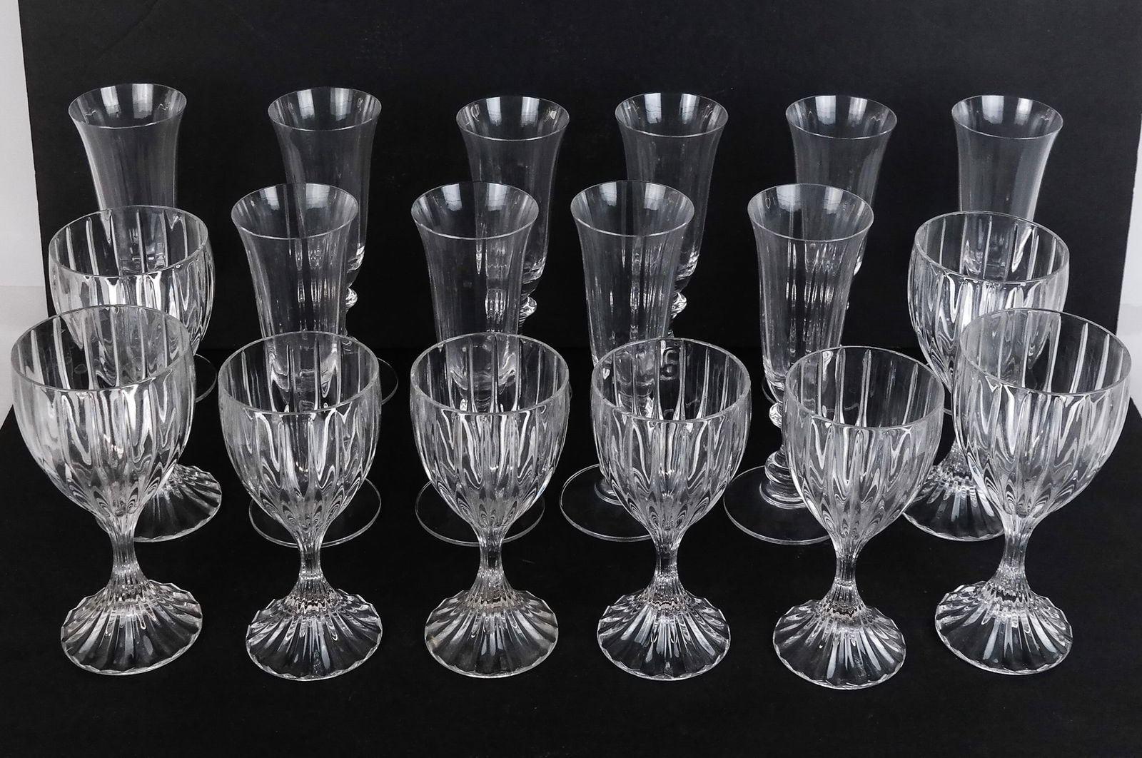 Mikasa Crystal Stemware, 18: Mikasa crystal partial stemware, comprising 10 "French Countryside" champagne flutes [7.5" H], 4 "Park Lane" red wine goblets, and 4 "Park Lane" white wine glasses. Overall condition is good, with lit