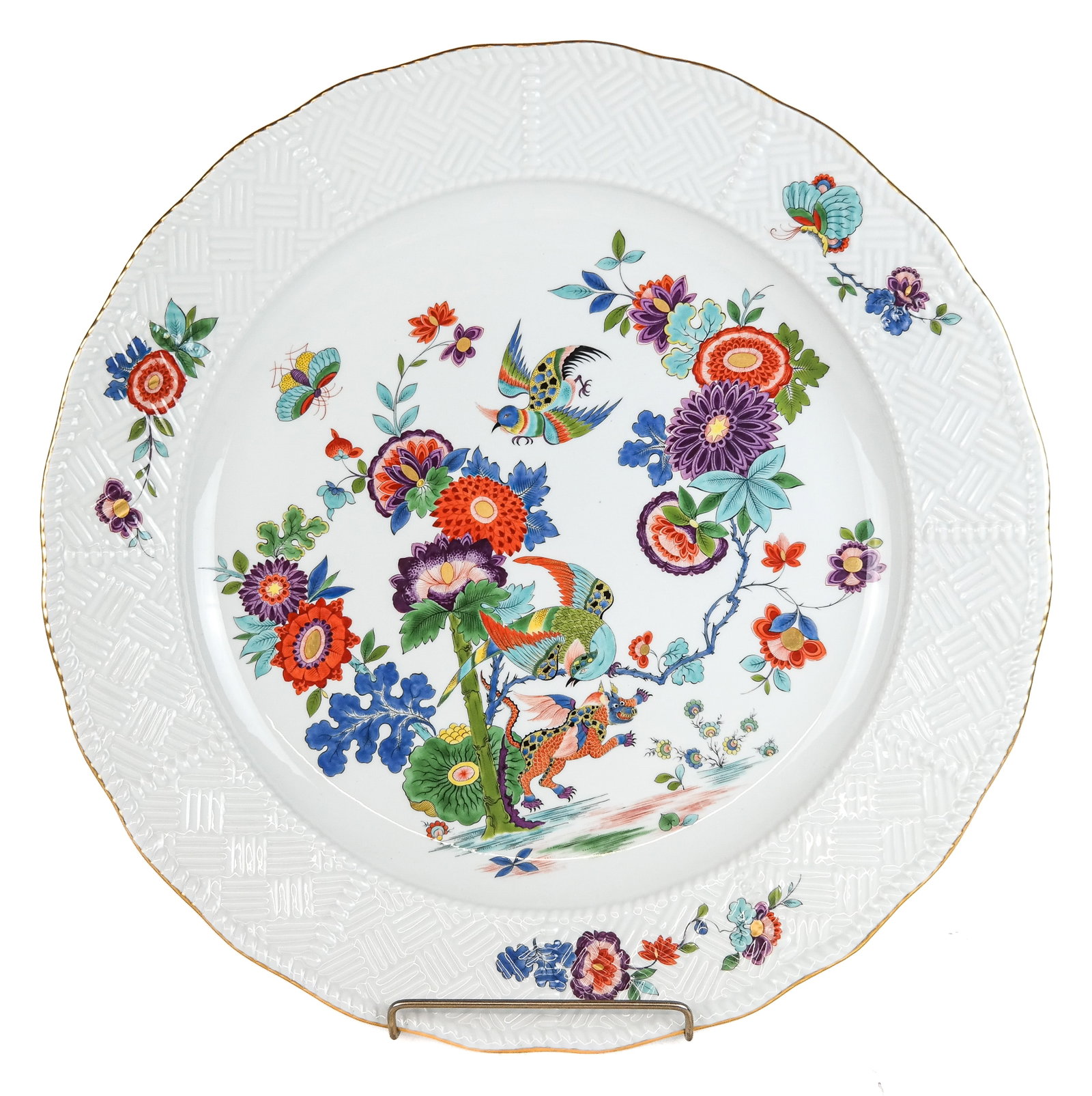 Meissen Porcelain "Indian Flower" Charger: Meissen porcelain chinoiserie decorated "Indian Flower" charger, German, circa 1930, gently shaped rim gilded and enclosing a basketweave embossed border, hand-painted throughout with flowers, butterf