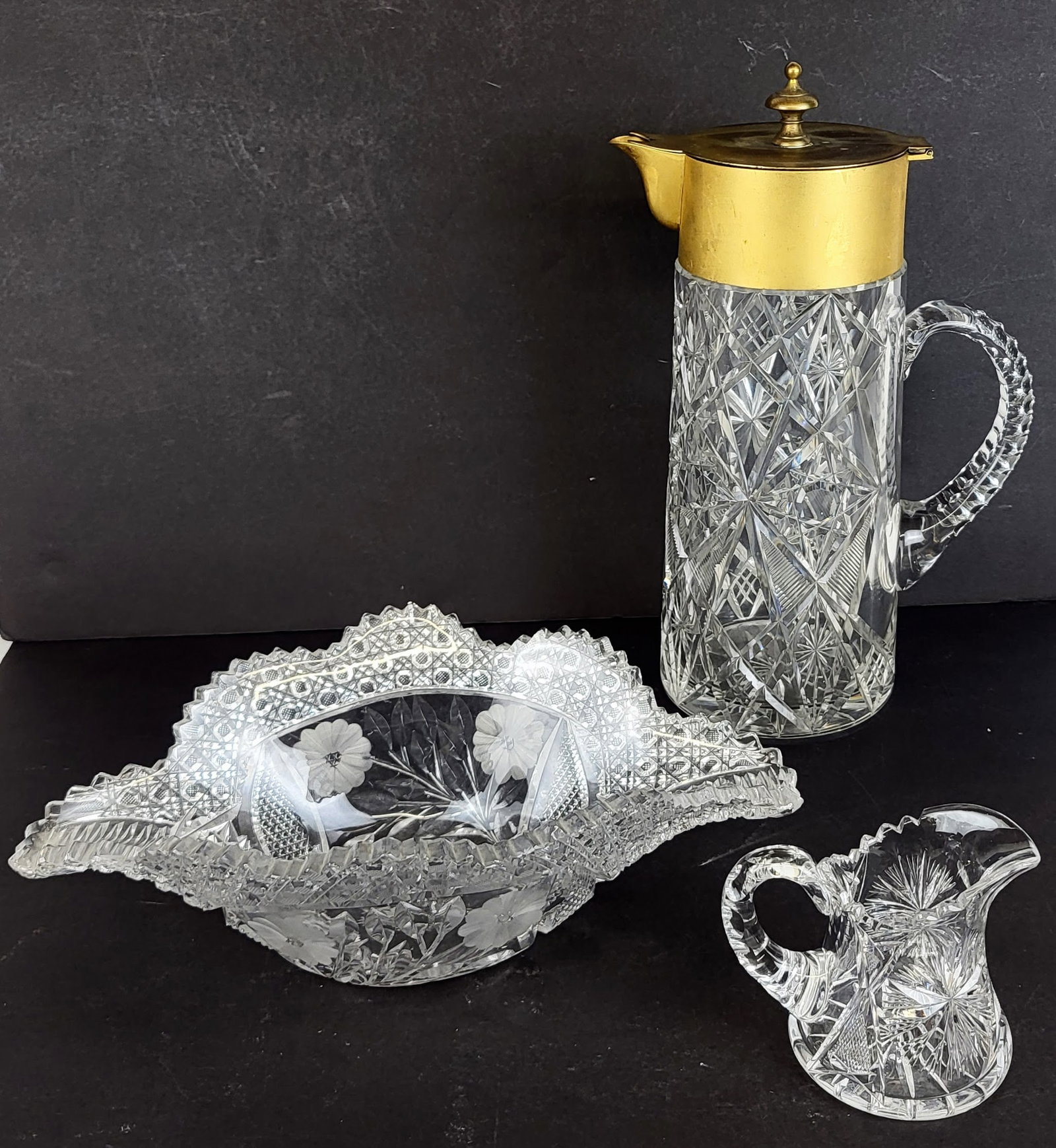 American Brilliant Cut Crystal and Glass Tableware: American brilliant cut crystal and glass tablewares, mostly 20th century, comprising lemonade pitcher with brass collar and lid, fruit / wine bowl, and creamer [Lemonade pitcher: 14.25" H x 9" W x 6" 