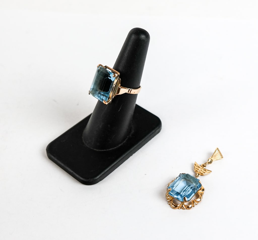 Gold and Topaz Ring and Pendant: Gold and topaz ring and pendant comprising a 14 karat gold tested ring, size US 6.25 with a topaz, and an 18 karat gold tested pendant with a topaz and decorative mounting, both unmarked. Inclusive we