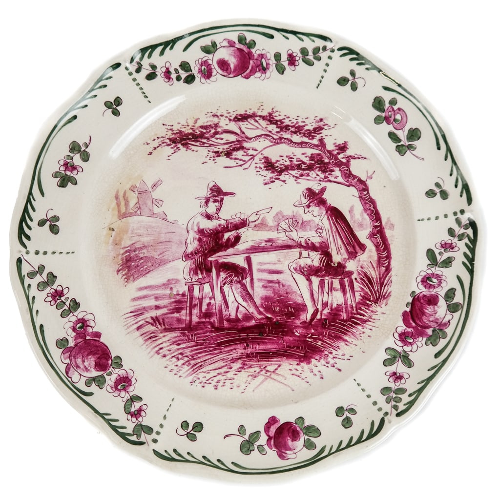 Villeroy and Boch Faience Plates, 11: Eleven Villeroy and Boch landscape decorated faience plates, circa 1920, with foliate border and hand-painted genre scenes, with original Villeroy and Boch Saar Basin marks concealed and spurious Tour