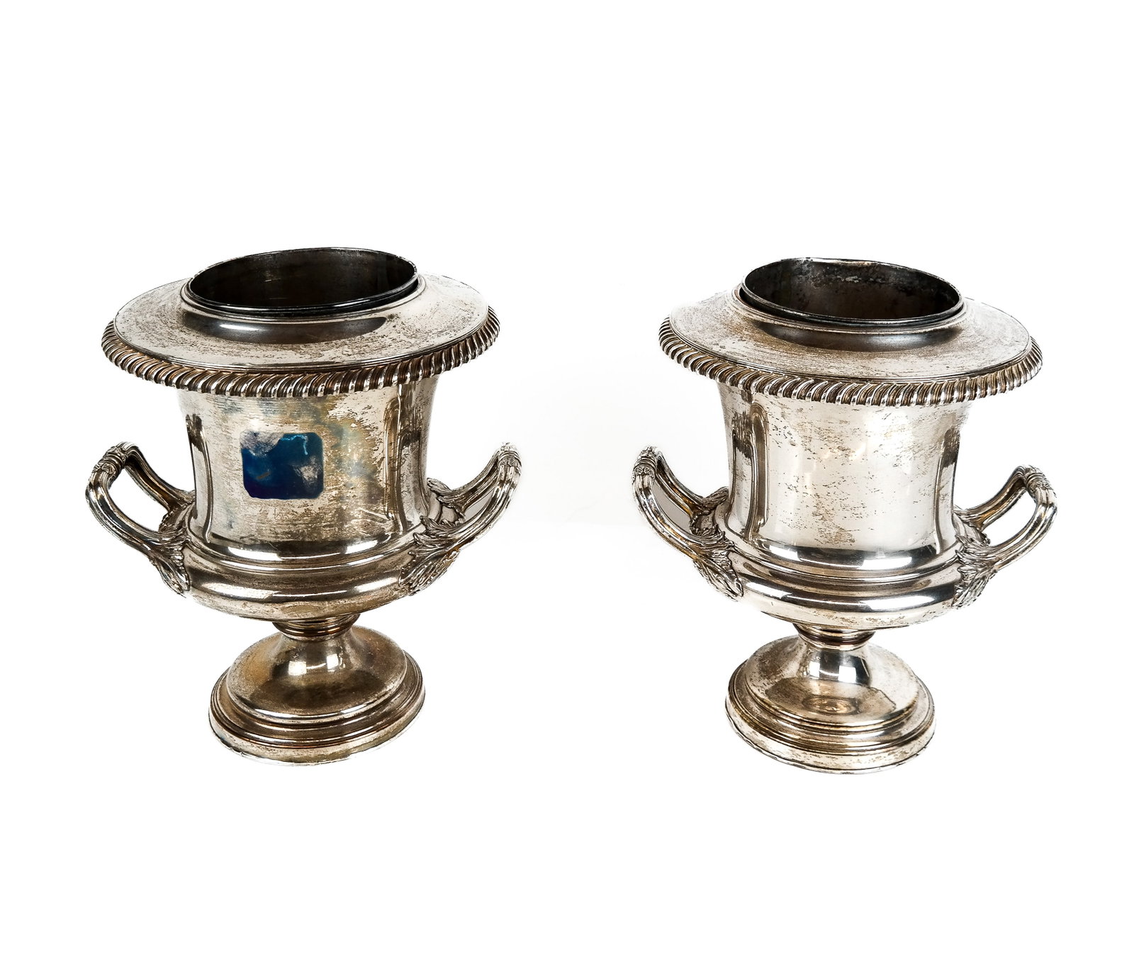 Pair After Sheffield Silver Plate Wine Coolers: Pair of after Sheffield silver plate jardiniere form wine coolers, 20th century, with a reticulated lip, removable insert, two handles attached with acanthus forms, and a round foot, marked to base, l