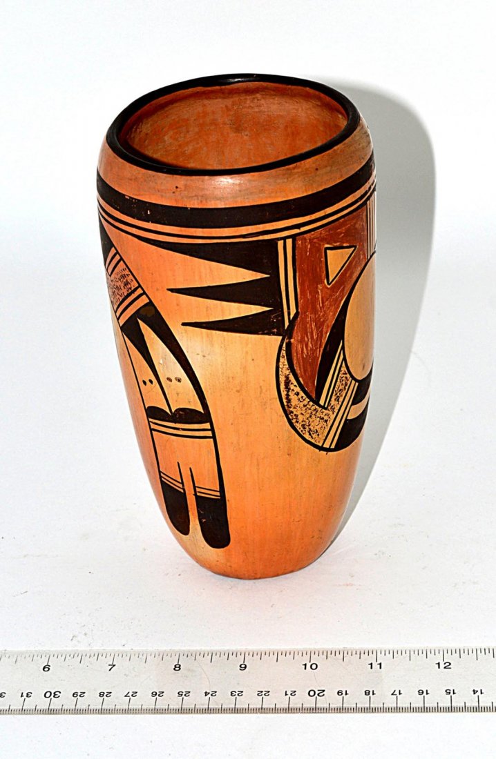 Hopi Pottery Vessel: Vase-form earthenware vessel with black and ochre geometric design. 7 3/8" H x 4 3/8" Dia. Some wear.
