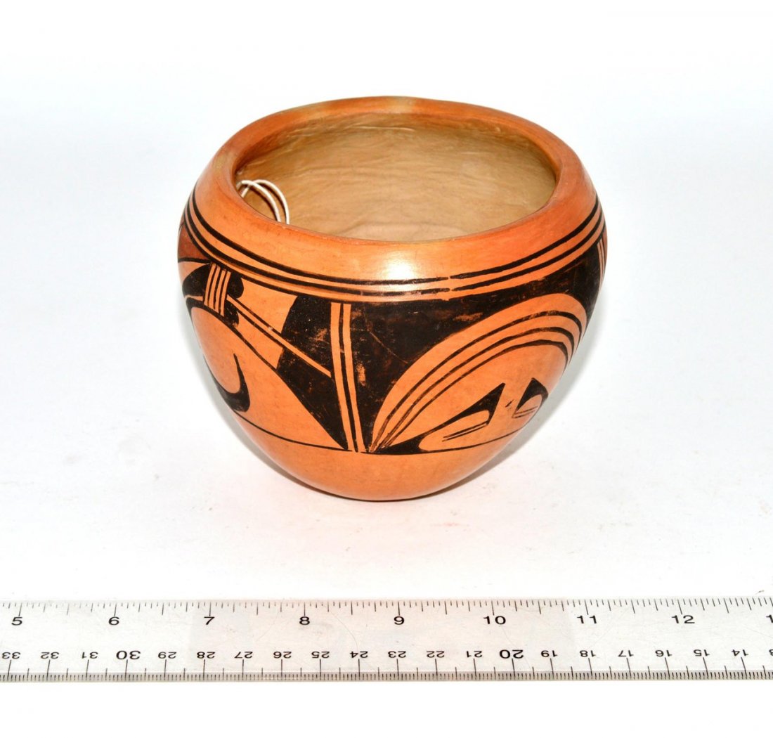 Hopi Pottery Bowl: Earthenware bowl with black and ochre geometric design. 4 3/4" Dia x 3 7/8" H. Light wear.