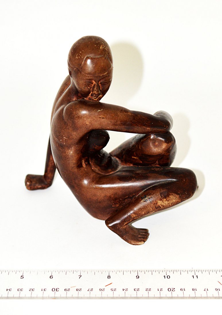 Vintage Chinese Ceramic Figure, Seated Nude: Depicts a seated female nude resting head on shoulder. Bears a mottled brown finish. 4 1/2" W x 7 1/8" D x 7" H. Minor wear and chips to figure's left big toe.