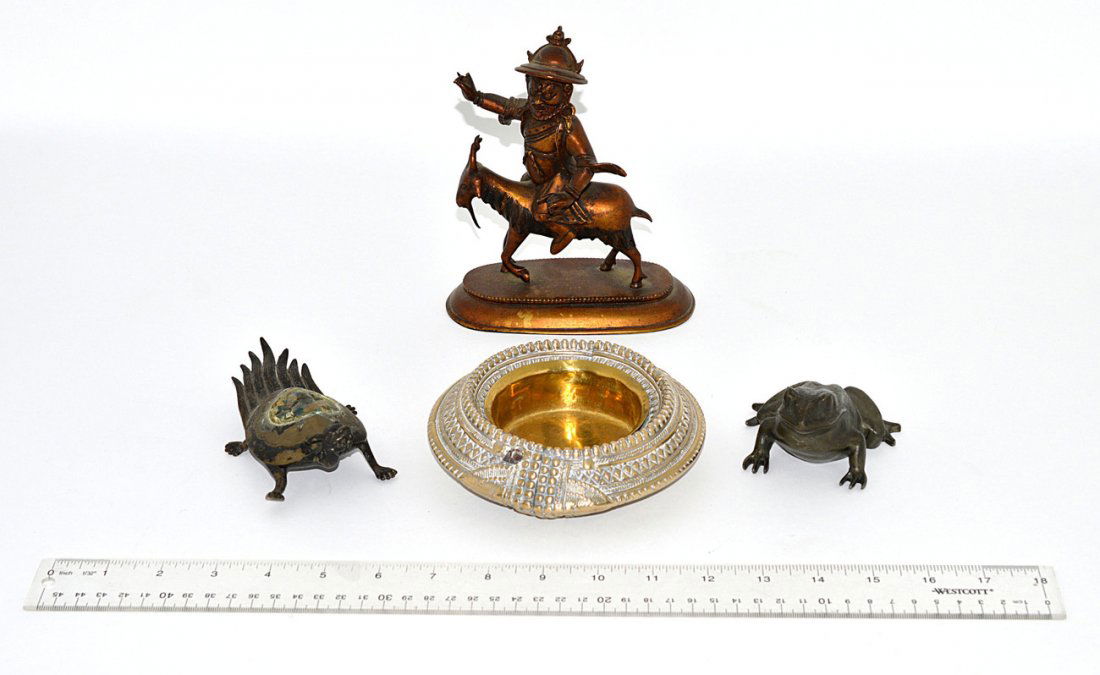 International Vintage Mixed Metal Group: Comprises: 1.) Pewter frog [3" x 3 1/2" x 2" H]. 2.) Bronze mythological Asian sea turtle [2 7/8" L x 5 1/2" x 1 7/8" H]. 3.) Brass Chinese figure riding a goat. [5 1/2" x 3" x 6 1/2" H]. 4.) Indian s
