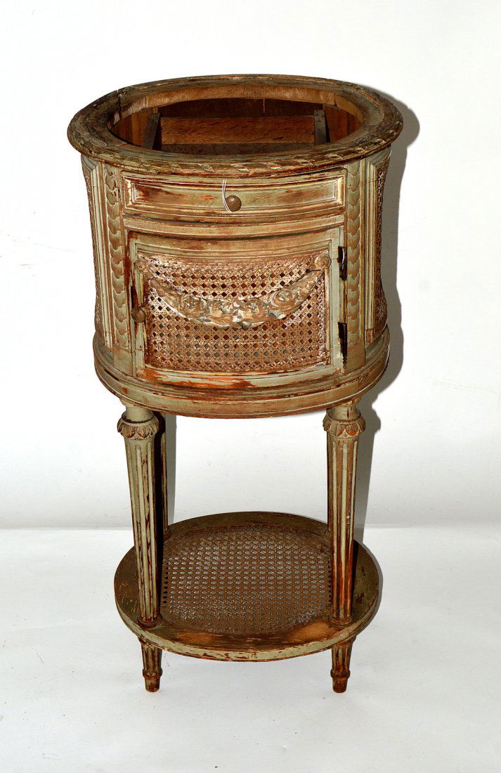 Antique French Marble Top Table: Oval carved and decorated marble inset table, caned all around. Good, as with age. 33 1/2" H x 15 1/2" x 17 1/2".