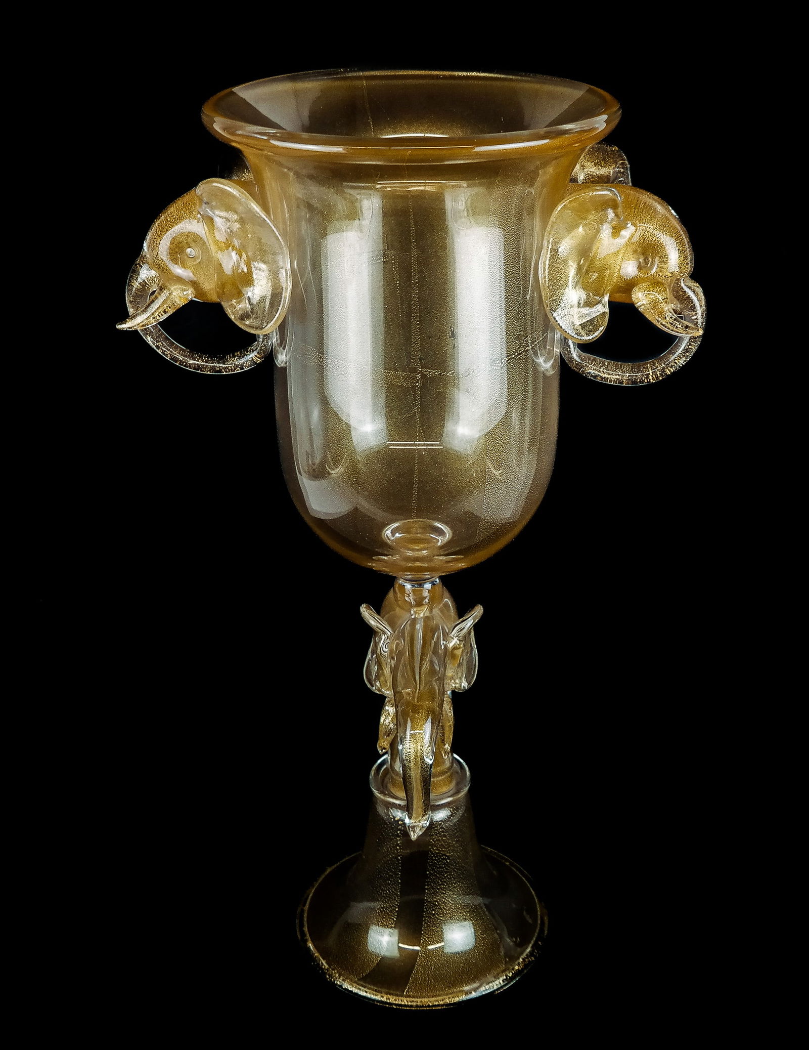 Venetian Art Glass Gold Flecked Avventurina Urn: Unusual Venetian art glass gold flecked "aventurine" urn with elephant-head handles and central support, possibly by Salviati, Murano [22" H x 13.5 " W x 9" D]. Overall condition is good. From the est