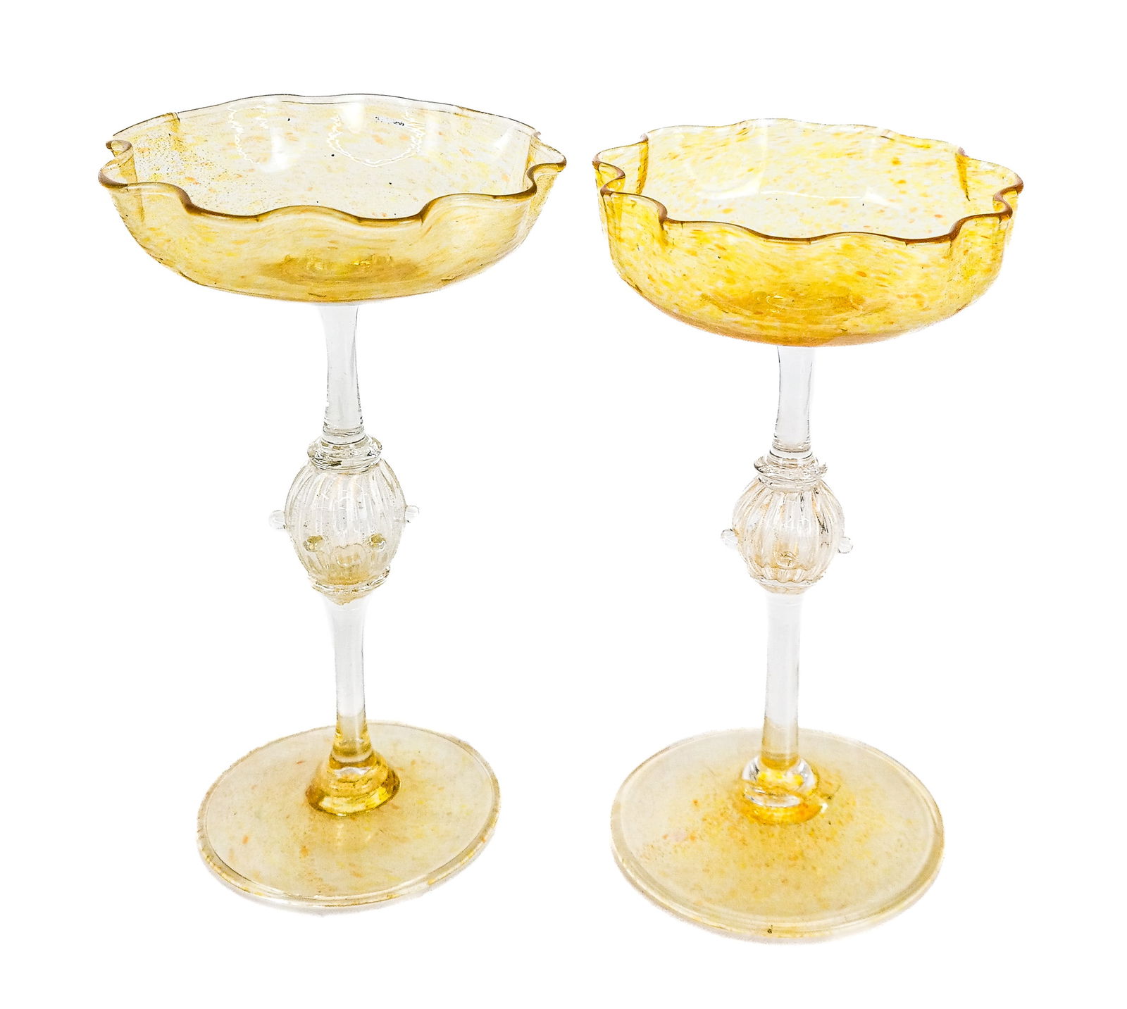 Pair of Venetian Art Glass Chalices: Pair of Venetian art glass colorless and gold flecked "Aventurine" chalices, Murano, the wavy shallow bowls above long narrow rods each with textured gold flecked bulbs and terminating in gold-colored