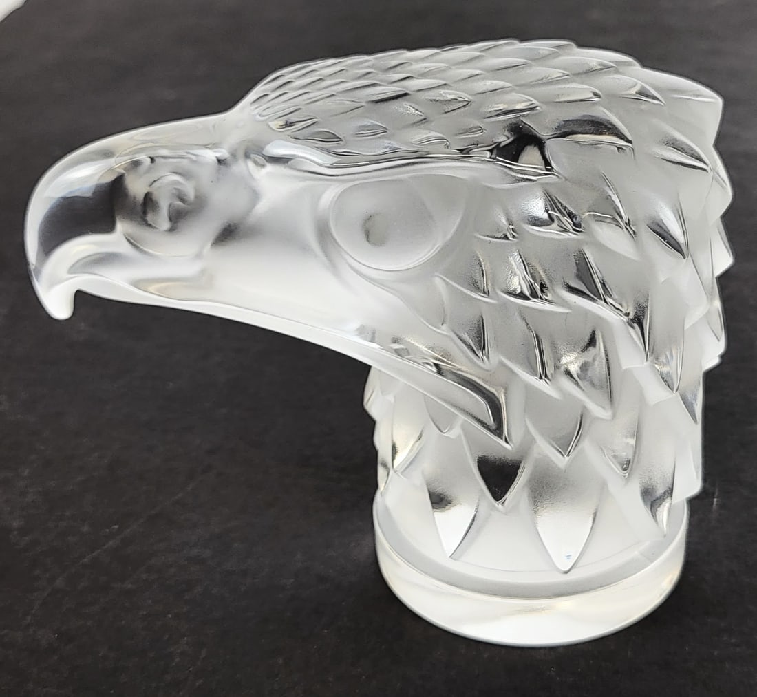 Lalique "Tete D'Aigle" Paperweight: Lalique France "Tete D'Aigle" crystal paperweight, 21st century, in clear and frosted crystal, marked Lalique France to base. [4.5" H x 3.5" W x 6" D]. Overall condition is good. From the esteemed col