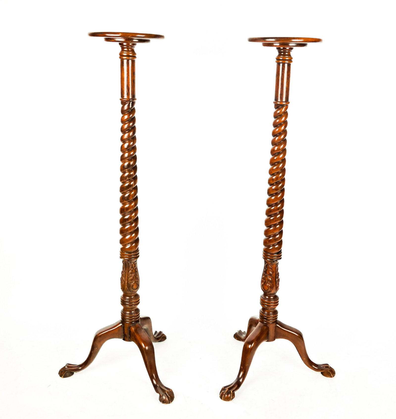 Pair of Mahogany Pedestals: Pair carved mahogany pedestals, late 20/21st century, with a barley twist neck, over carved acanthus leaves and three ball and claw feet. [60.5" H x 22.5" Diameter; top: 12" Diameter]. Overall conditi