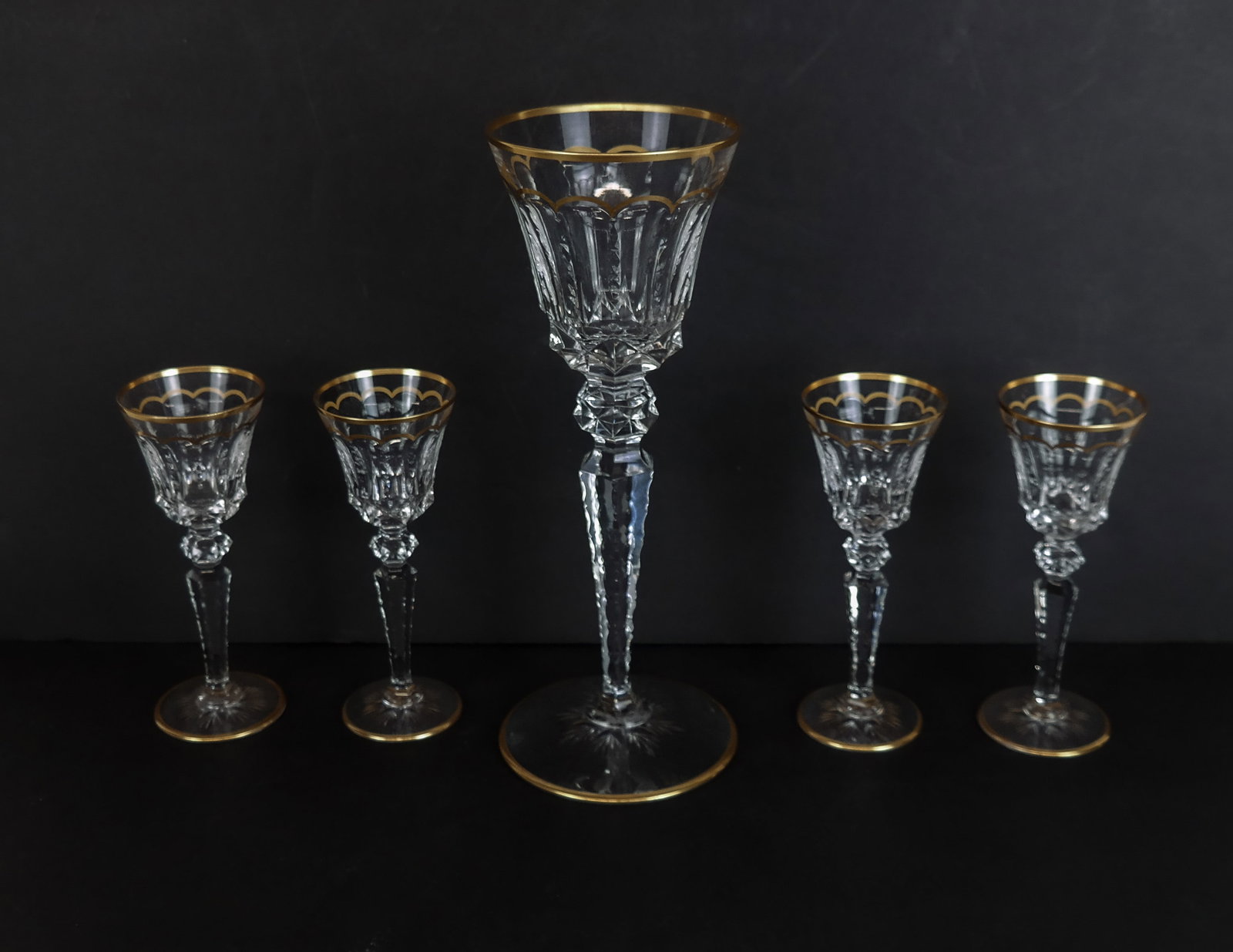 Saint Louis "Excellence" Stemware, 5: Five articles of Saint Louis cut crystal stemware, late 20th century, including a Hock wine goblet, and four cordials with gilt and cut decoration, all marked Saint Louis France to bases. [Hock wine g