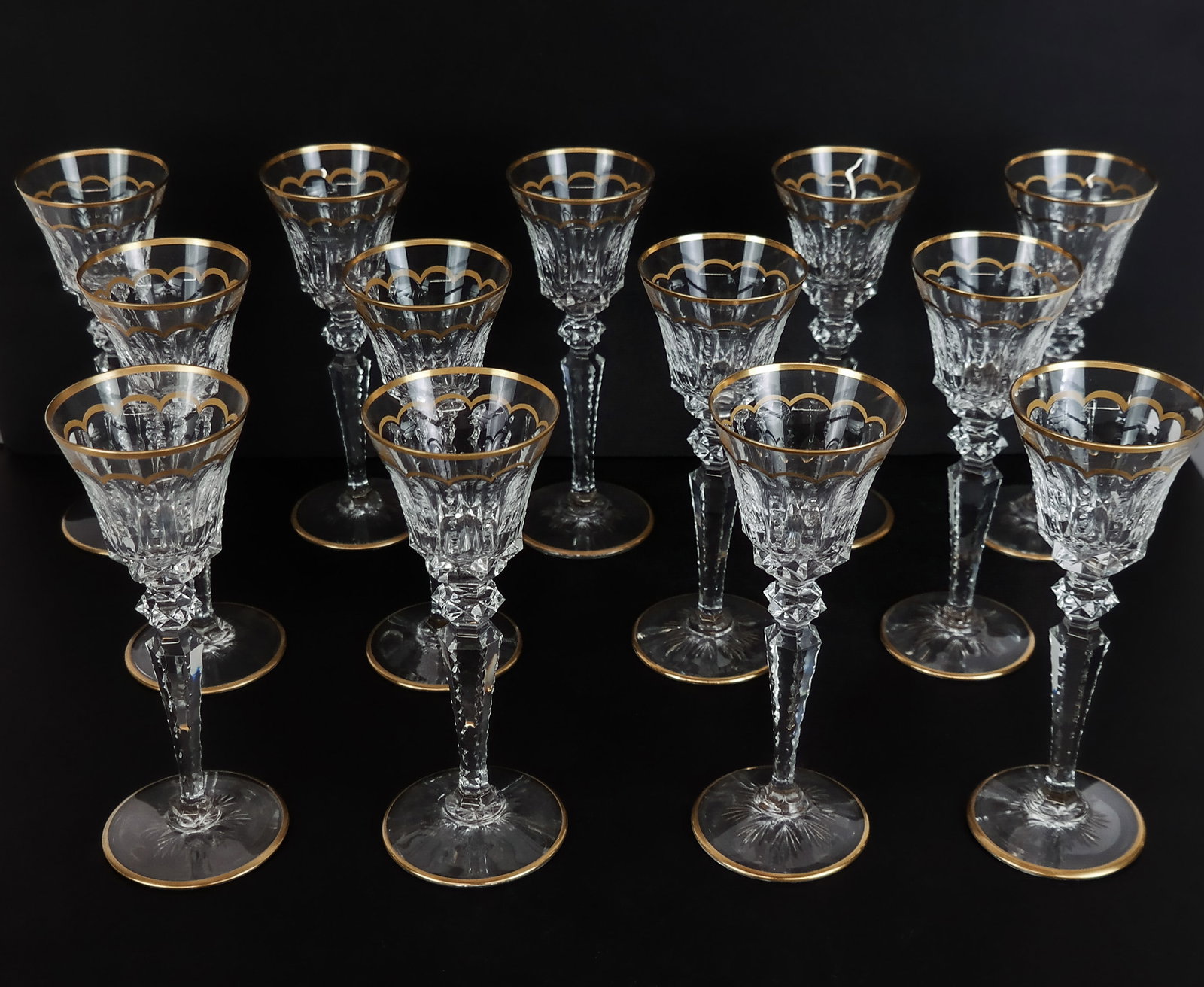 Saint Louis "Excellence" White Wine Goblets, 13: 13 Saint Louis France cut crystal "Excellence" white wine goblets, late 20th century, with cut and gilt decoration, all marked Saint Louis France to bases. [8" H x 3" Diameter]. Overall condition is g
