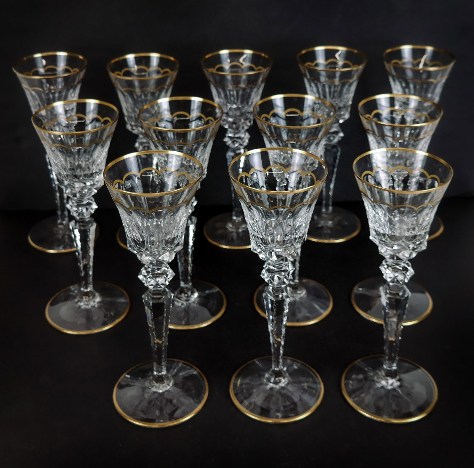 Saint Louis "Excellence" Red Wine Goblets, 12: 12 Saint Lous France cut crystal "Excellence" pattern red wine goblets, late 20th century, with cut and gilt decoration, all marked Saint Louis France to bases. [10" H x 3.25" Diameter]. Overall condi