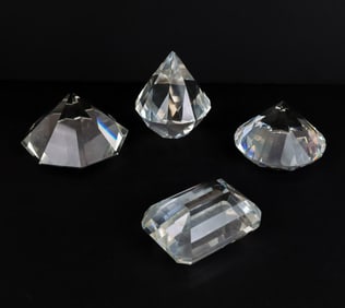 Four Gem-Cut Crystal Paperweights