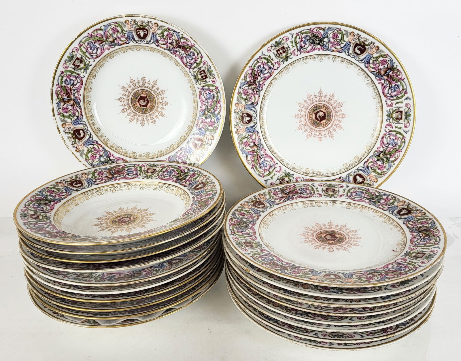 Richard Briggs Inc. Porcelain Plates & Bowls, 19: Richard Briggs Inc. porcelain part dinner service, Boston, late 19th century/fist half 20th century, arts & crafts inspired, the colorful foliate scrolling border in blue, green and pink entwined with