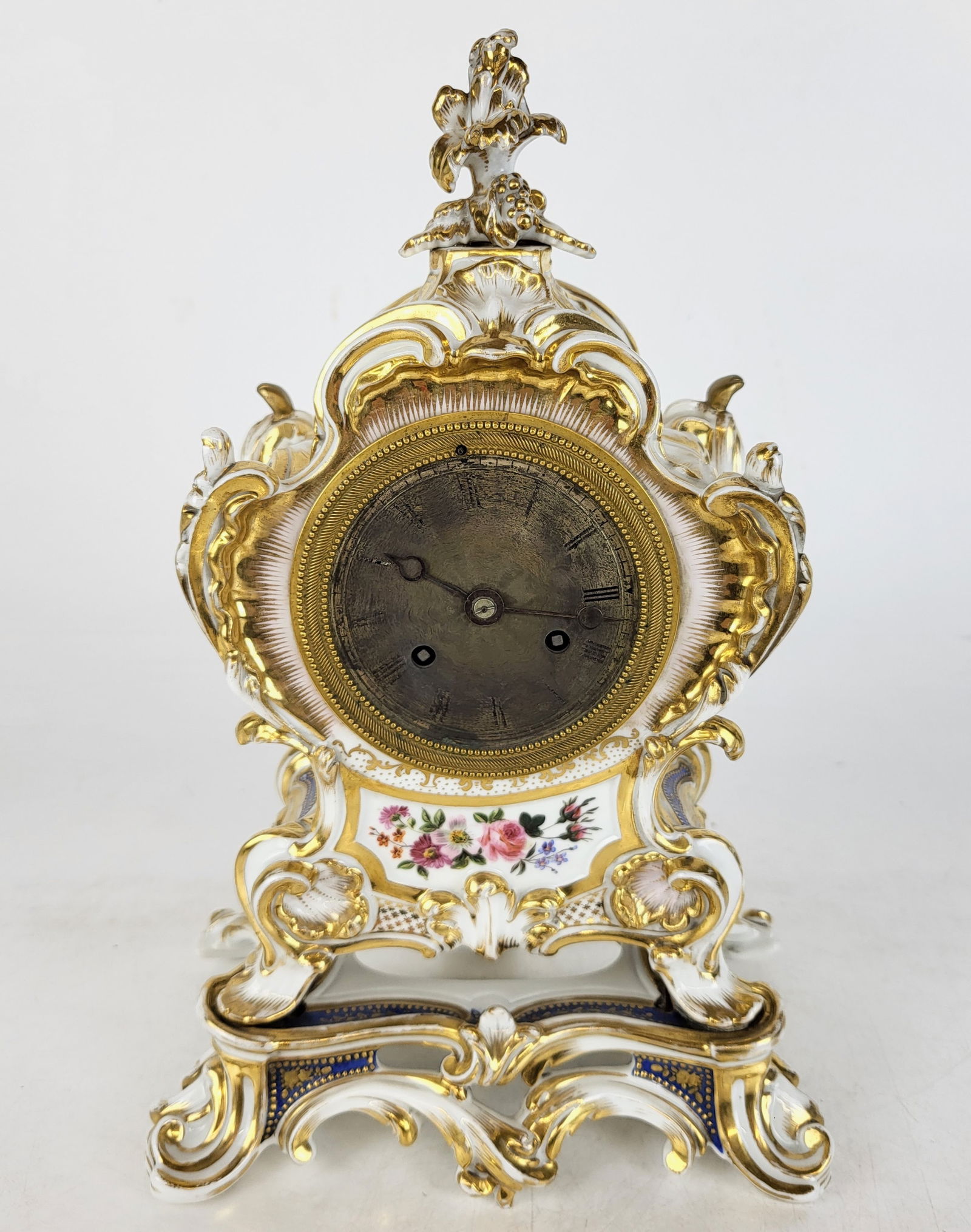 French Decorated Porcelain Mantel Clock: French Jacob Petit decorated porcelain petite mantel clock, 19th century. [13" H x 8" W x 5" D]. Missing glass on back cover, otherwise in good condition.