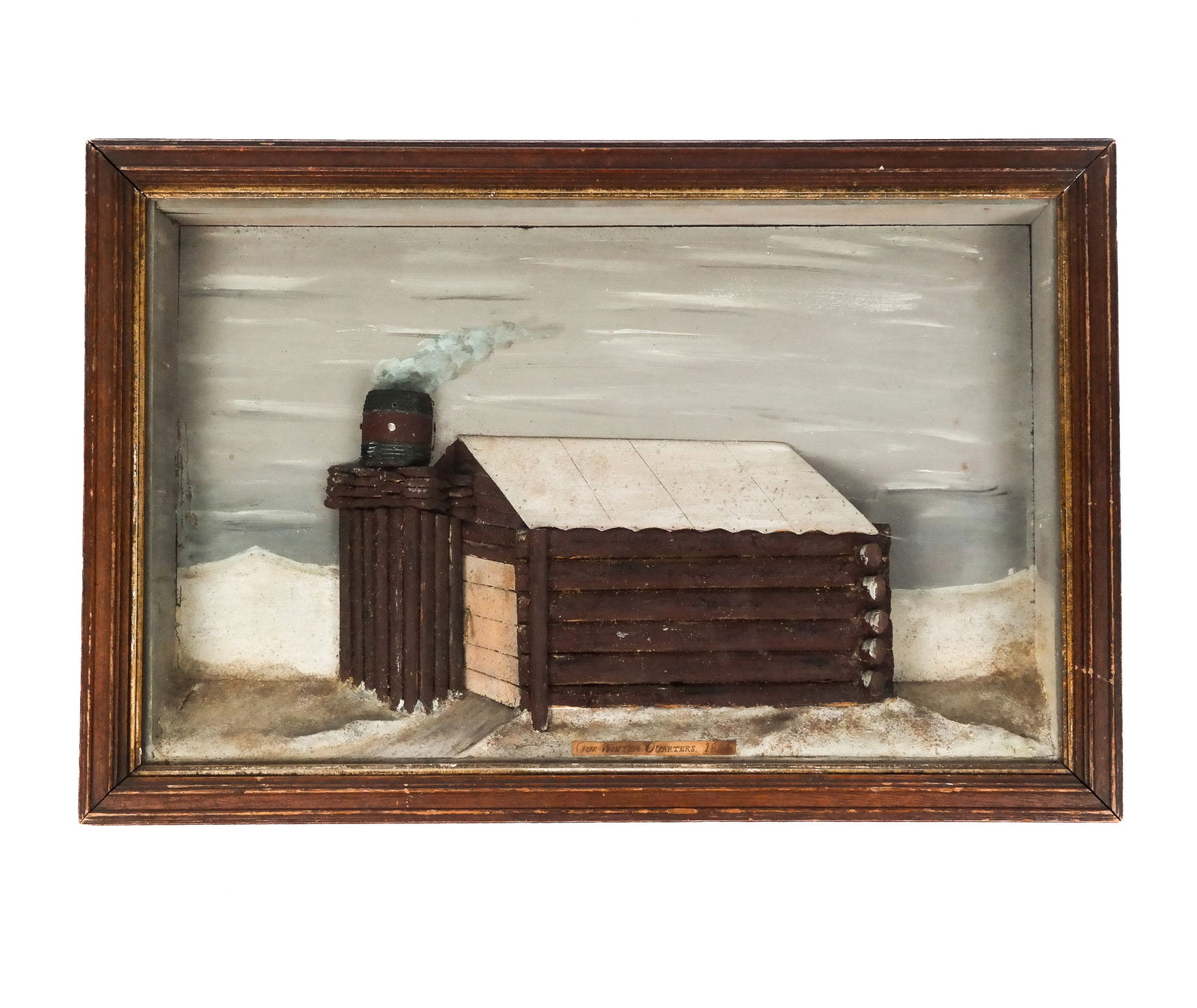 Log Cabin In Shadowbox Frame: Log cabin in a shadowbox frame, bearing label center reading: "Our Winter Quarters 1864". [Art: 14.75" H x 23" W; Frame: 17.75" H x 26.5" W x 3.25" D].