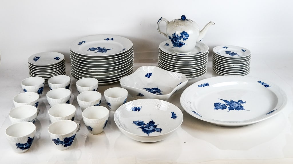 Royal Copenhagen Blue Flowers Braided Part Service: Royal Copenhagen "Blue Flowers Braided" partial porcelain service, 1964, comprising a teapot, 12 teacups, 11 saucers, 12 salad plates, 12 dinner plates, 12 dessert plates, an oblong serving dish, a se
