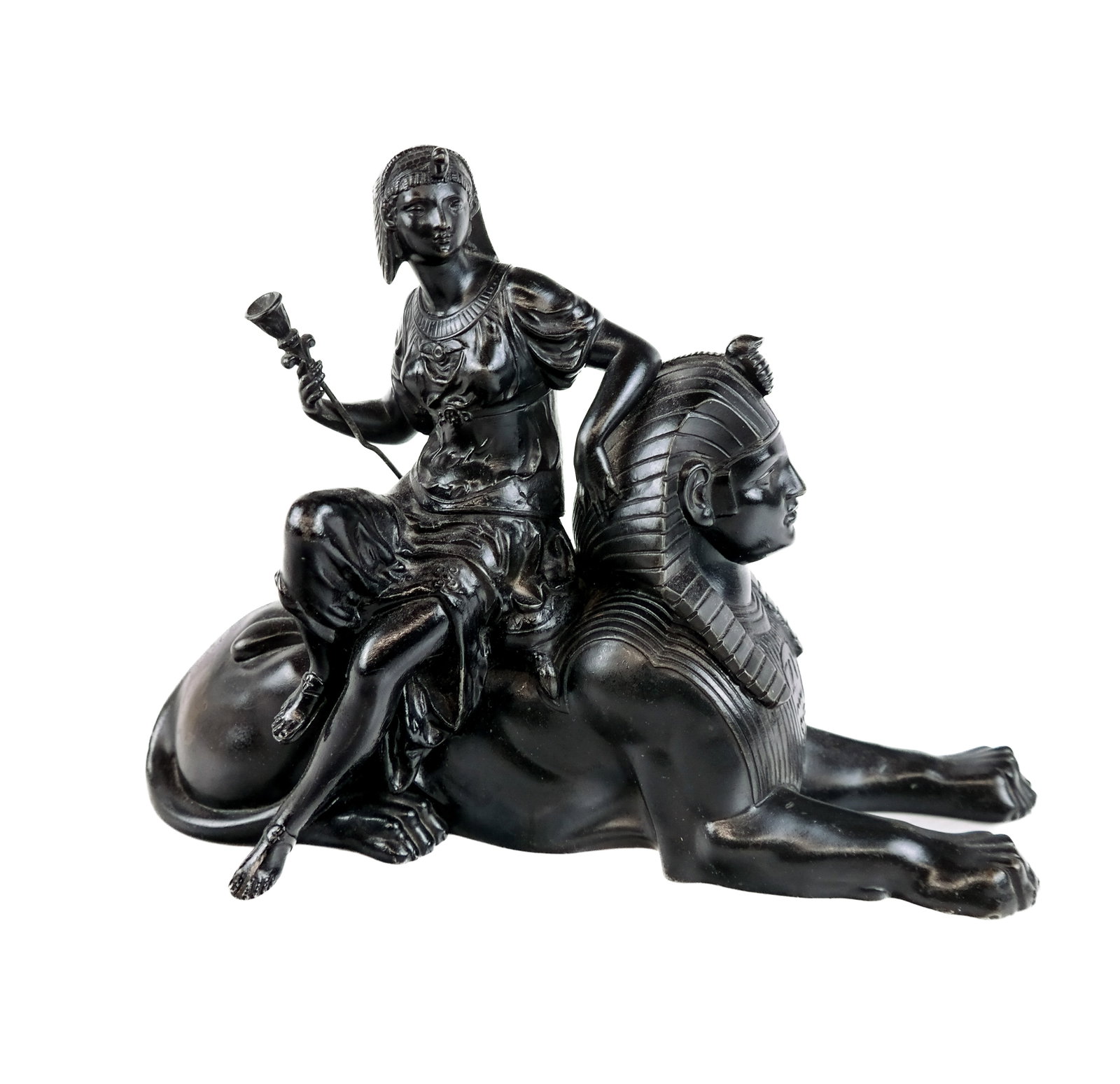 Egyptian Sculpture of Woman on Sphinx: Metal sculpture of a woman on a sphinx, early 20th century, possibly lacking a base (drilled). [8"H x 10" W x 4" D]. In good condition.