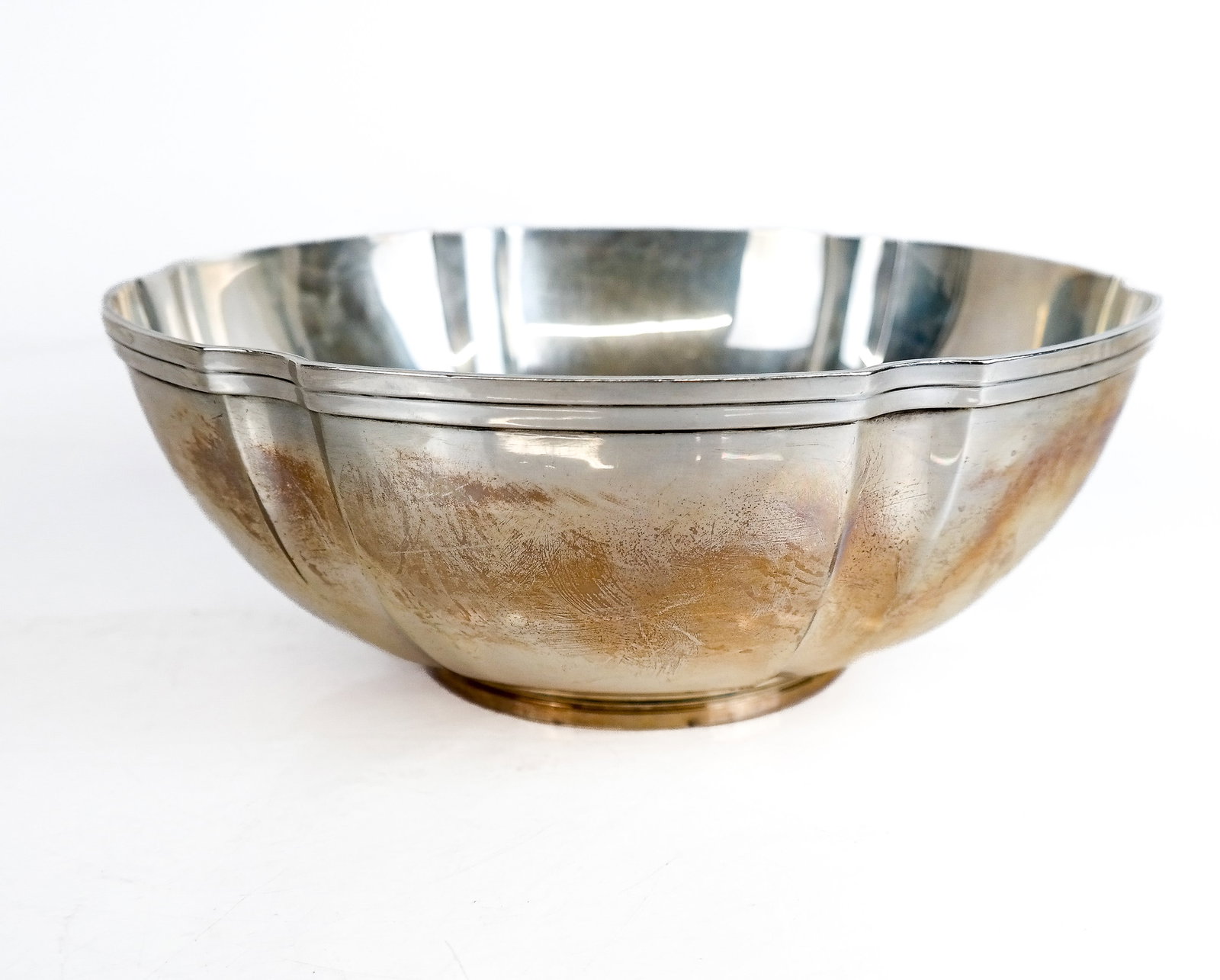 Tifffany & Co. Makers Sterling Silver Bowl: Tiffany & Co. Makers sterling silver scalloped bowl, 20 ozt., marks to base. [3.5" H x 9.25" Diameter]. Overall condition is good.