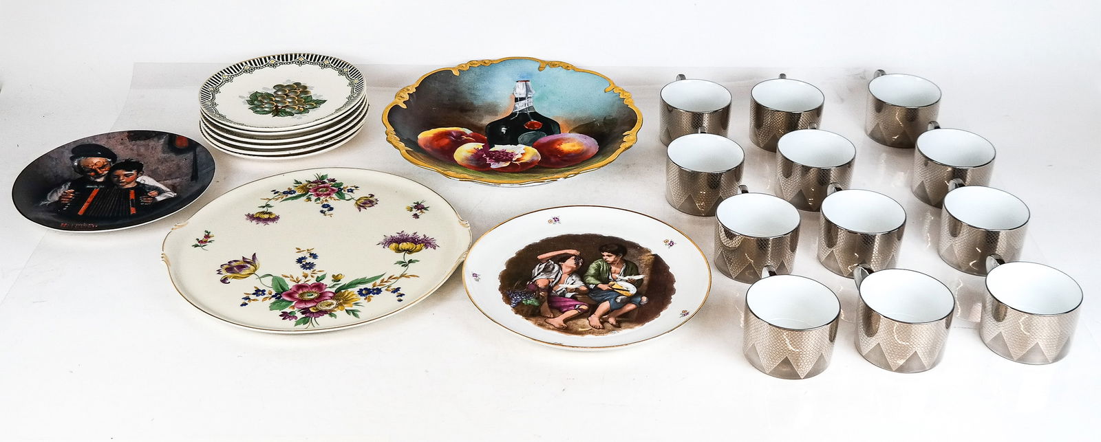 Norman Rockwell and other Serveware, 22: Collection of serveware comprised of Norman Rockwell "The Music Maker" plate by Knowles, a Langenthal porcelain plate, six Villeroy and Boch "Il'Argento salad plates, a Limoges charger, and a German f