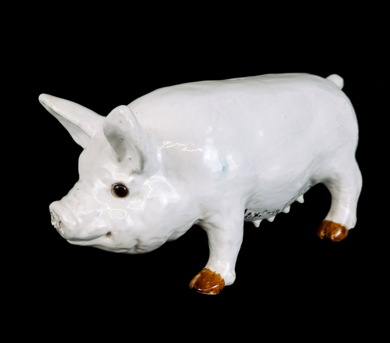 Bavent Majolica Sculpture of a Pig, Signed: Bavent France majolica sculpture of a pig, early 20th century, made from terra cotta with inset glass eyes, stamped Bavent to base, and made in France, with Mayhew Copley, "603 Madison Ave, New York, 