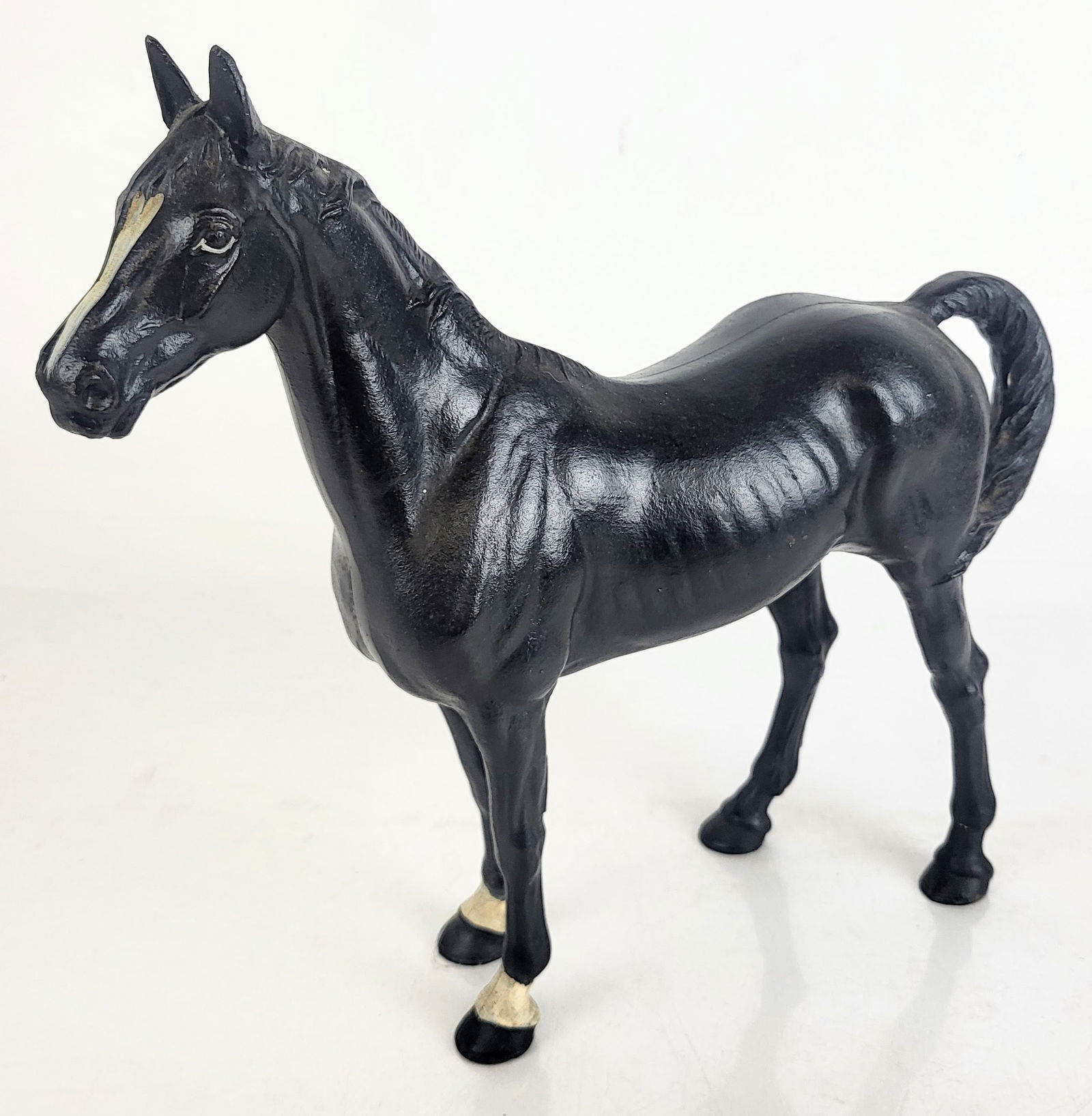 Hubley Cast Iron Horse: Hubley cast iron figure of a horse, circa 1930, with painted details to front legs and head. [10.5" H x 11" W x 3.25" W]. Overall condition is good. From the Estate of Laura Leonard Ault.