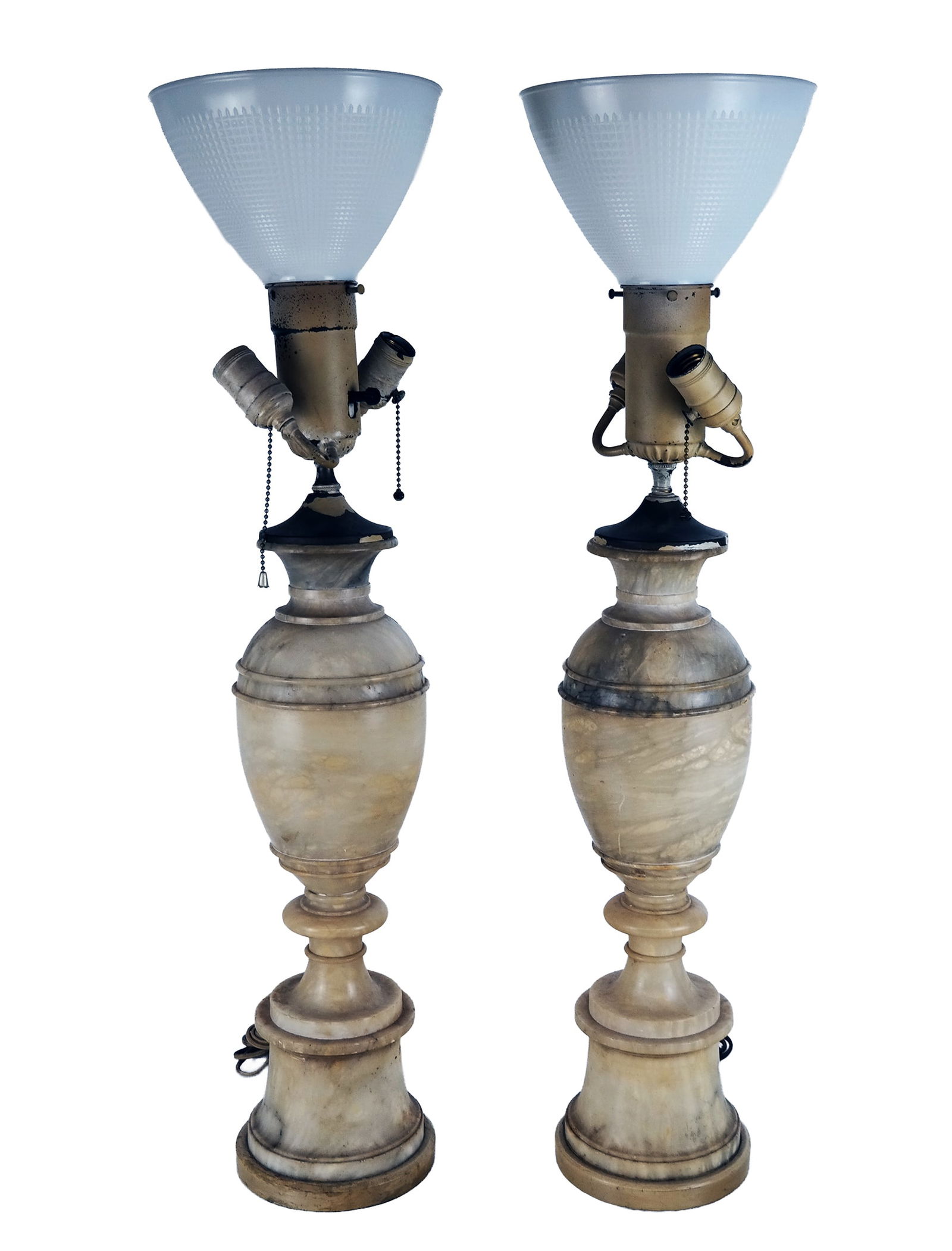 Pair Alabaster Urns Mounted as Lamps: Pair of alabaster urns mounted as lamps, early 20th century, with milk glass shades to upper and two exterior lights. [32" H x 6" Diameter]. Overall condition is good to fair with losses to paint and