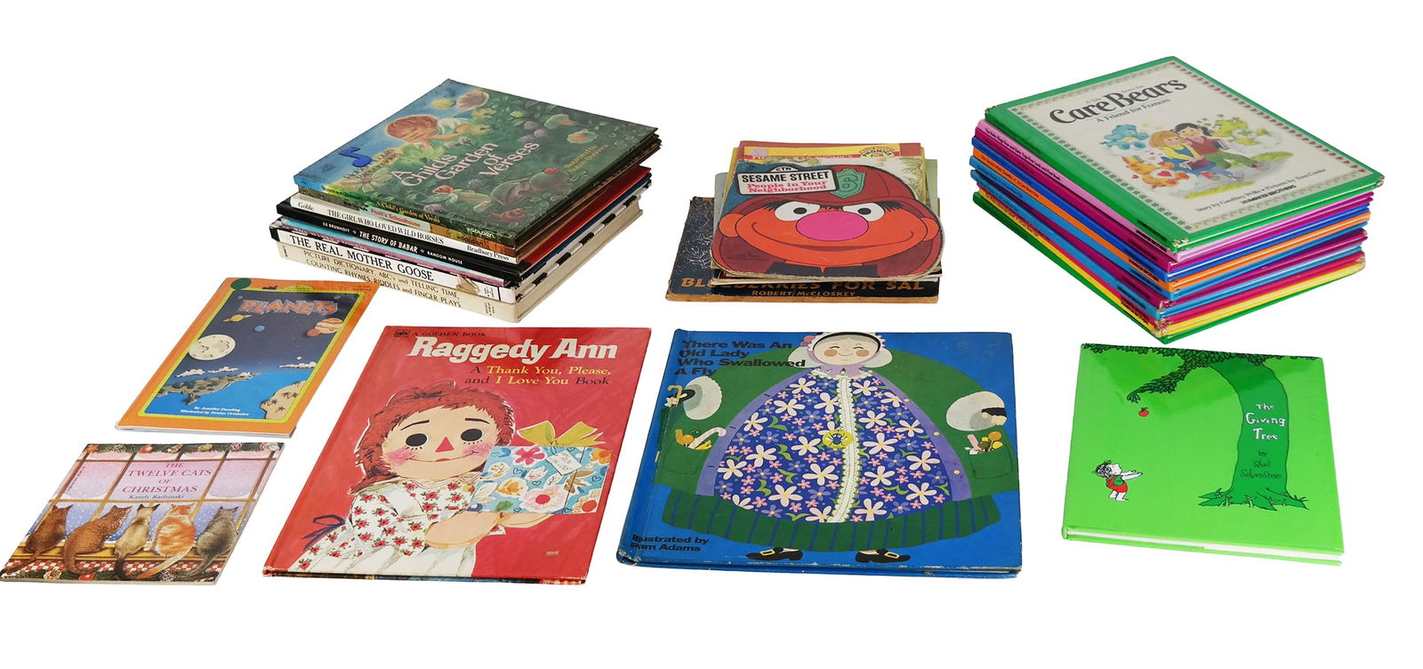 Group Children's Books: Group of Children's books including There Was an Old Lady Who Swallowed a Fly, Raggedy Ann, The Girl Who Loved Wild Horses, Pooh?s Schoolhouse, A Child?s Garden of Verses, Picture Dictionary, The Real